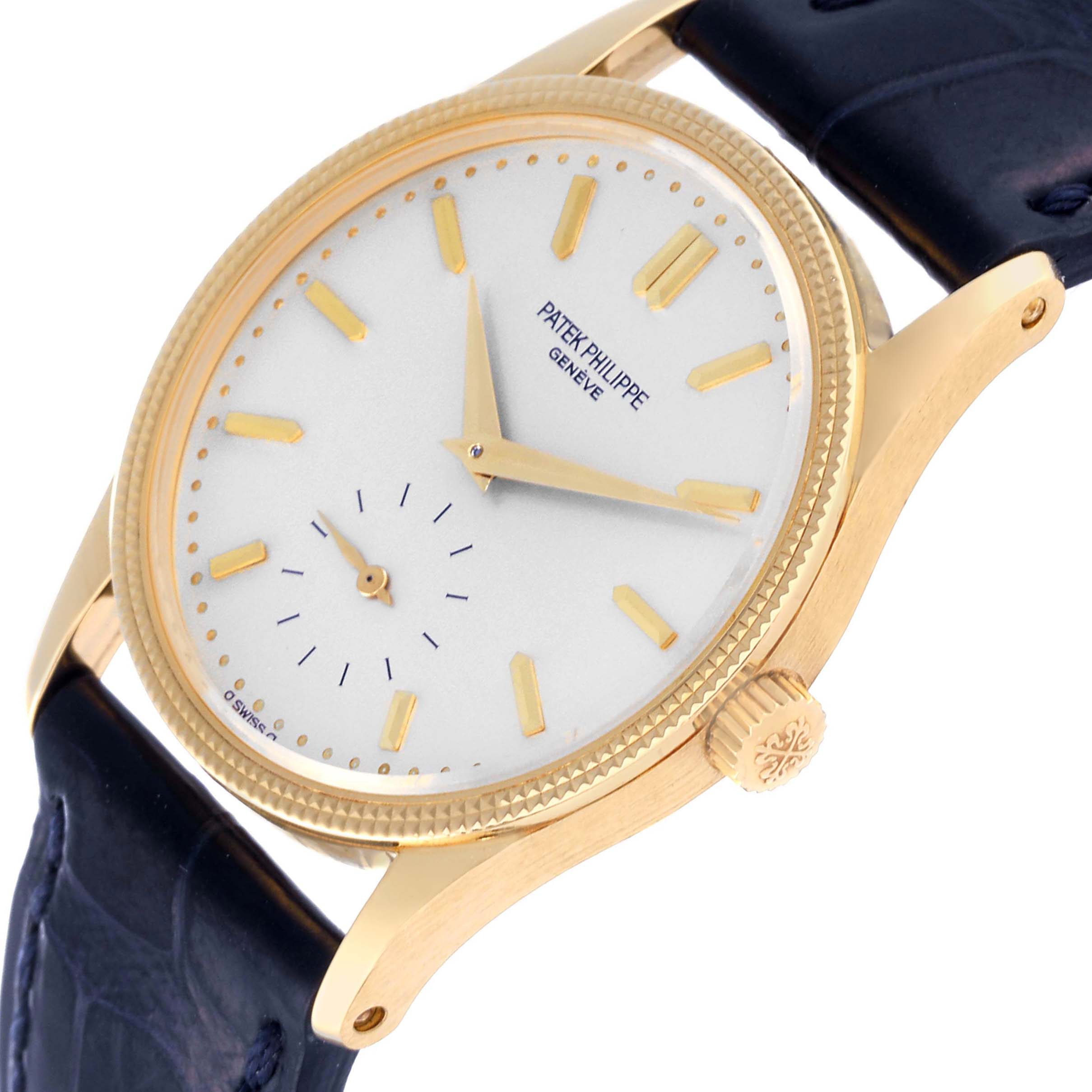 This Calatrava model by Patek Philippe is shown at a slight angle, highlighting the dial, crown, and part of the strap.
