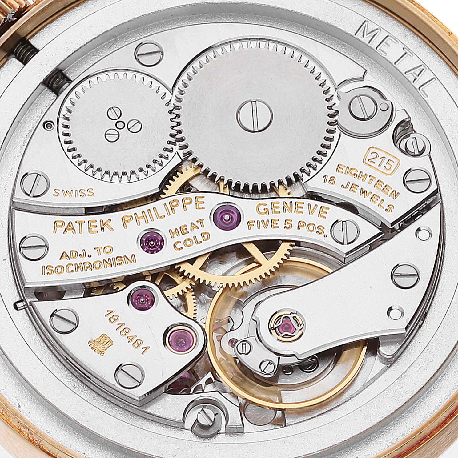 This image shows the intricate mechanical movement and inner workings of a Patek Philippe Calatrava 3796 Men's Yellow Gold Silver Dial 3796 Men's Yellow Gold Silver Dial watch.