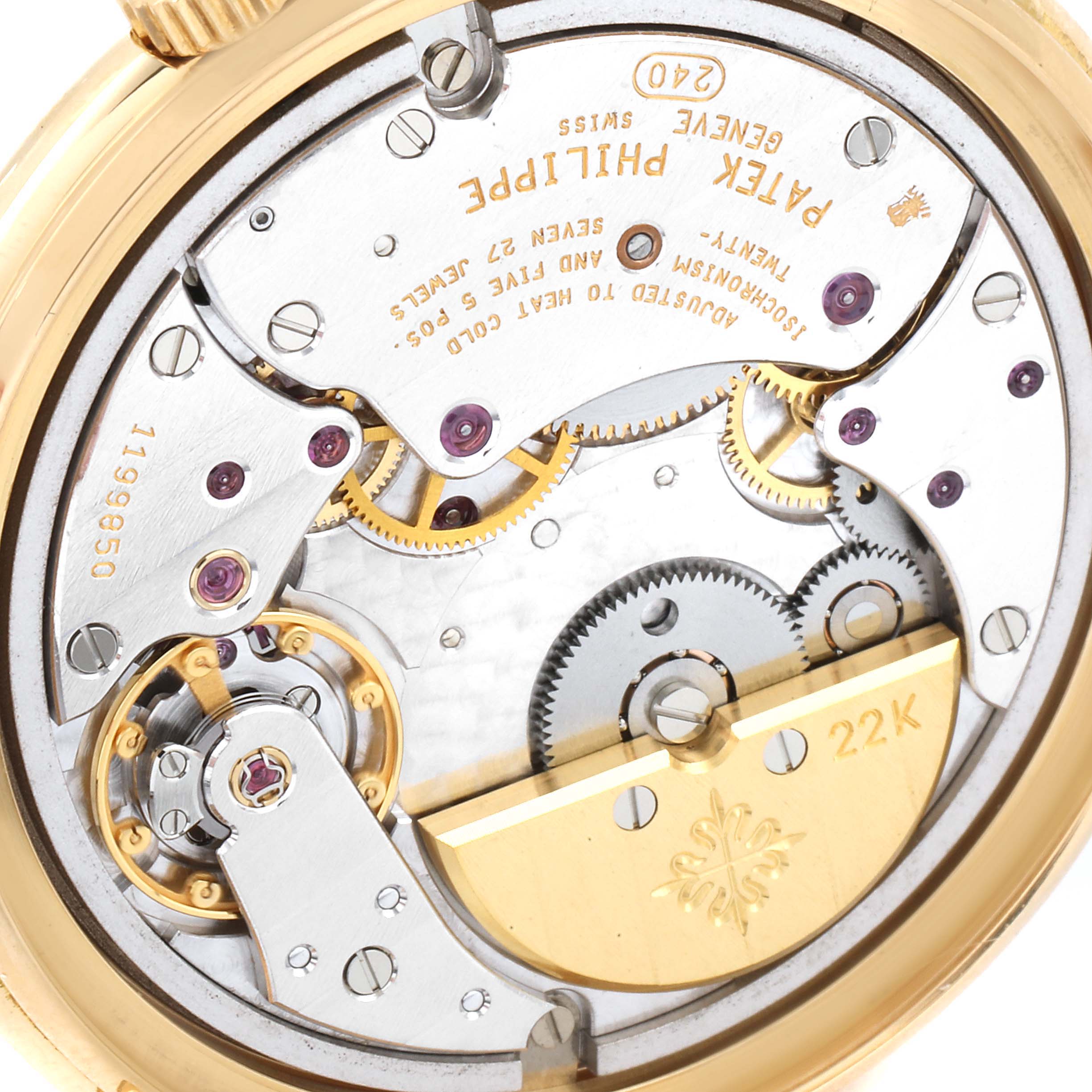 The image shows the backside of a Patek Philippe Calatrava 5032J Men's Yellow Gold Silver Dial 5032J Men's Yellow Gold Silver Dial watch, highlighting its intricate mechanical movement.