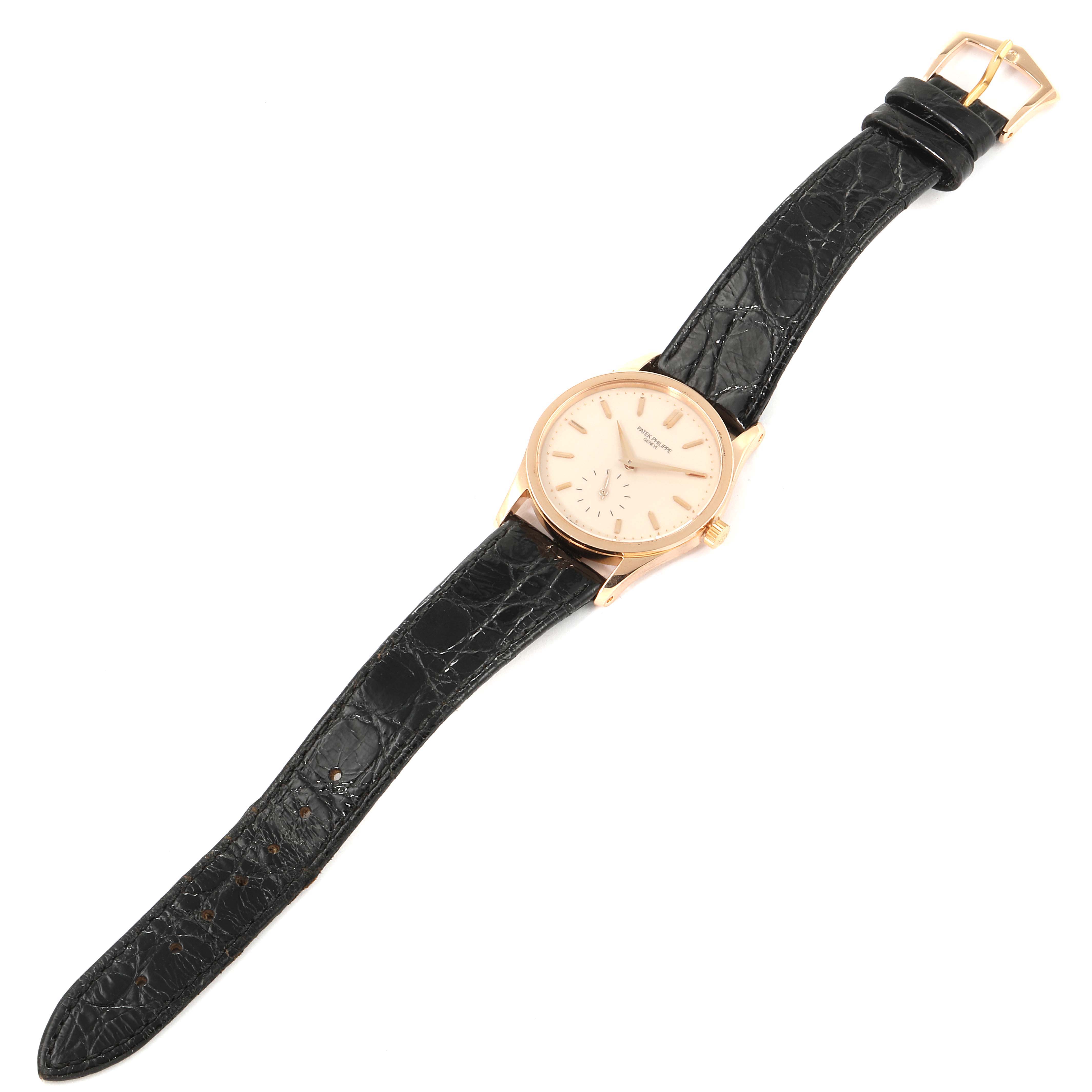 The image shows a Patek Philippe Calatrava 3796R Men's Rose Gold Silver Dial 3796R Men's Rose Gold Silver Dial watch from a top-down angle, highlighting the dial, case, and black leather strap.