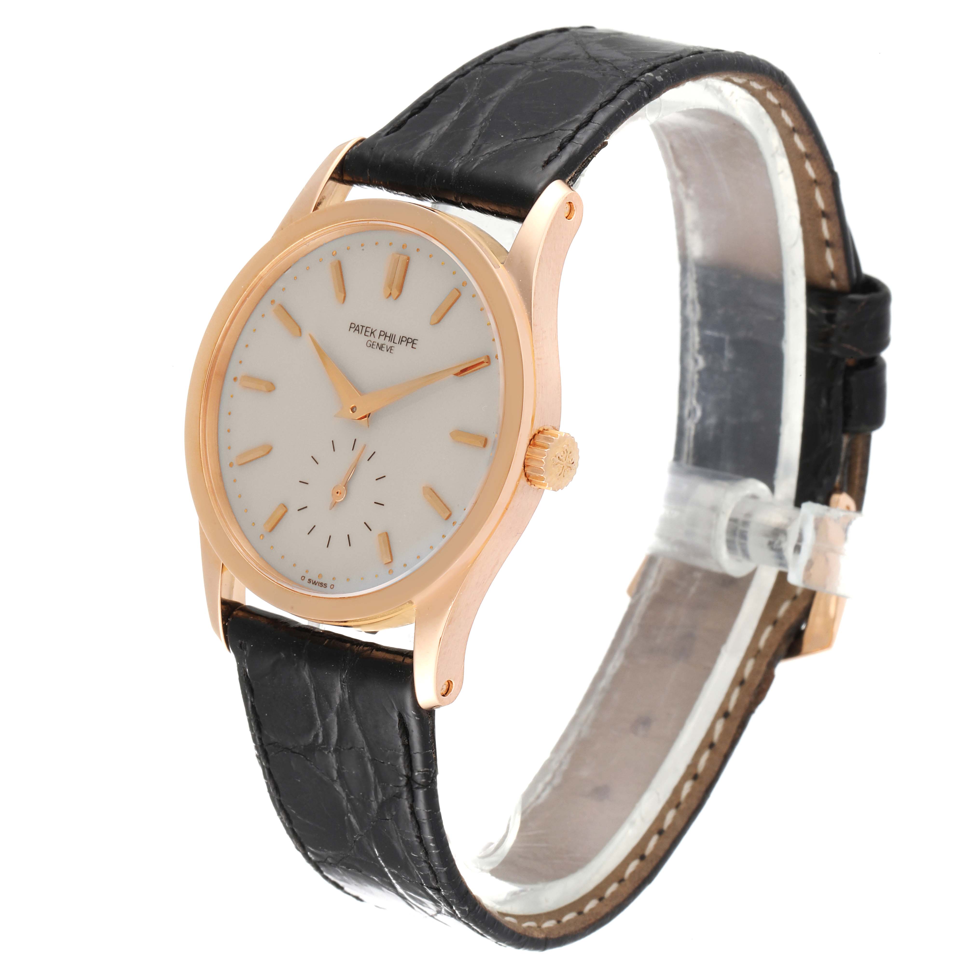 This image shows a side angle view of the Patek Philippe Calatrava 3796R Men's Rose Gold Silver Dial 3796R Men's Rose Gold Silver Dial watch, highlighting its face, bezel, crown, and leather strap.