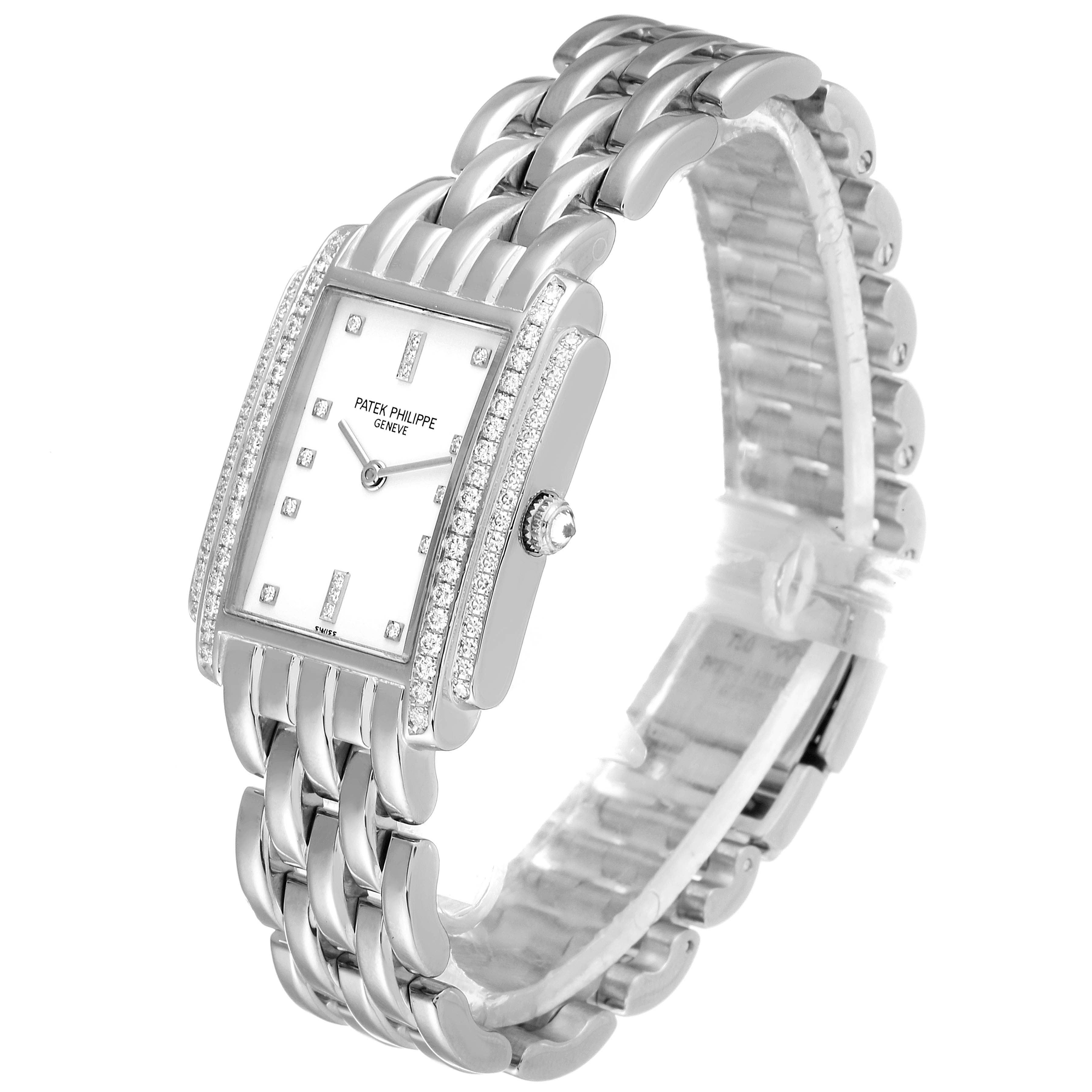 The image shows a Patek Philippe Gondolo 4825G/101 Women's White Gold White Dial 4825G/101 Women's White Gold White Dial watch at a three-quarter angle, highlighting its rectangular face, diamond bezel, and metal bracelet.