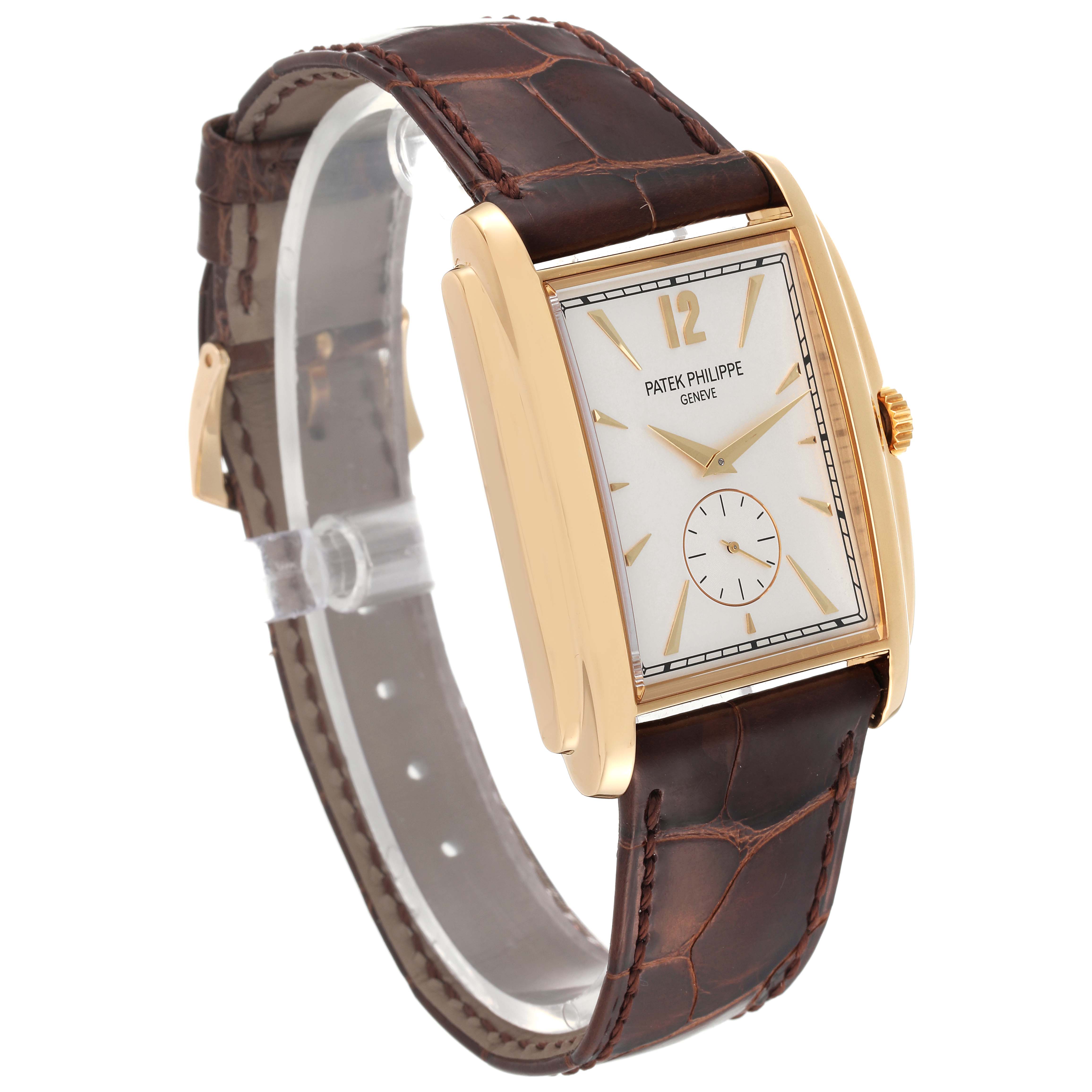 The image shows a side angle of the Patek Philippe Gondolo 5124J Men's Yellow Gold Silver Dial 5124J Men's Yellow Gold Silver Dial watch, displaying its rectangular face, gold case, and brown leather strap.