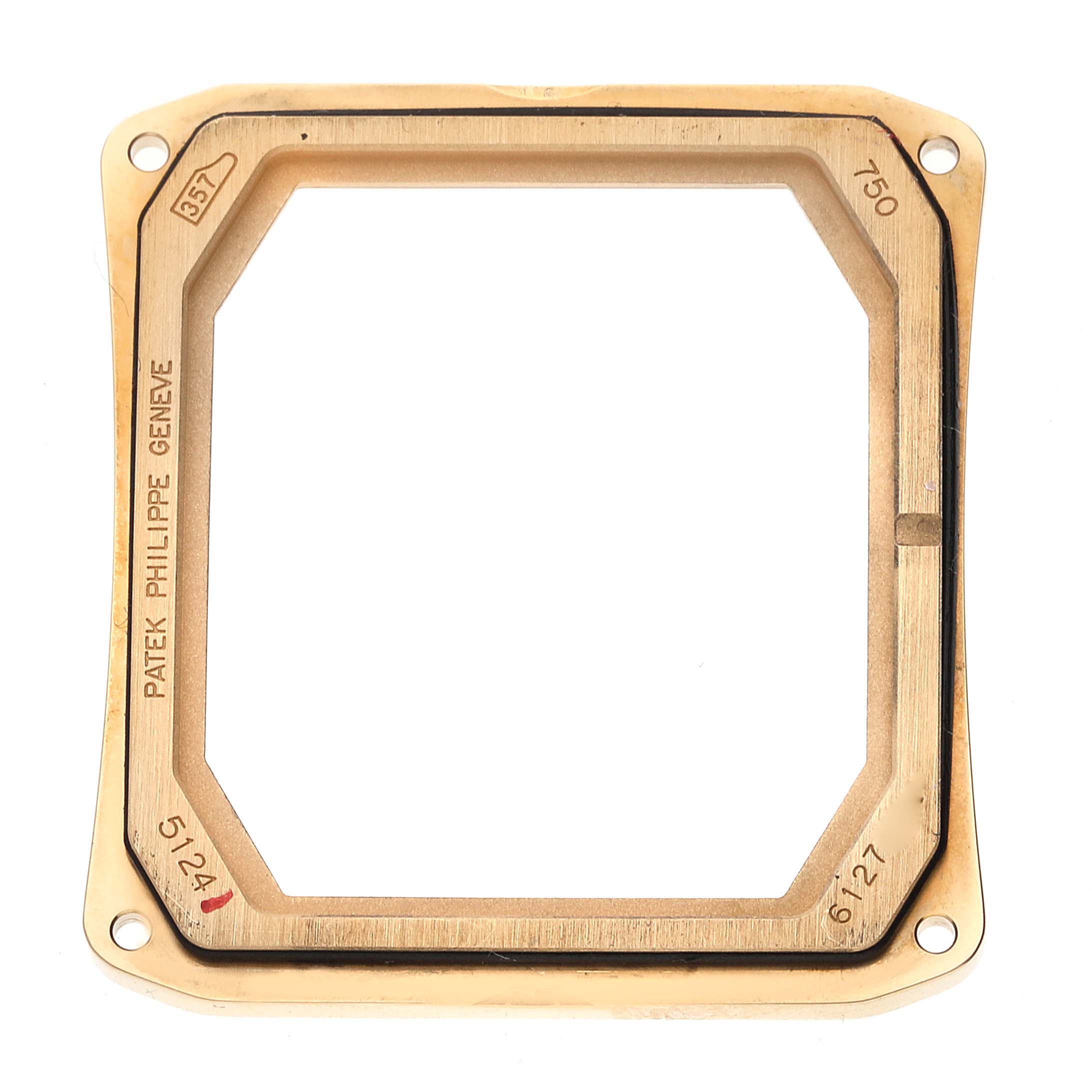 The image shows a close-up view of the case frame for a Patek Philippe Gondolo 5124J Men's Yellow Gold Silver Dial 5124J Men's Yellow Gold Silver Dial watch, highlighting its rectangular shape and inscriptions.