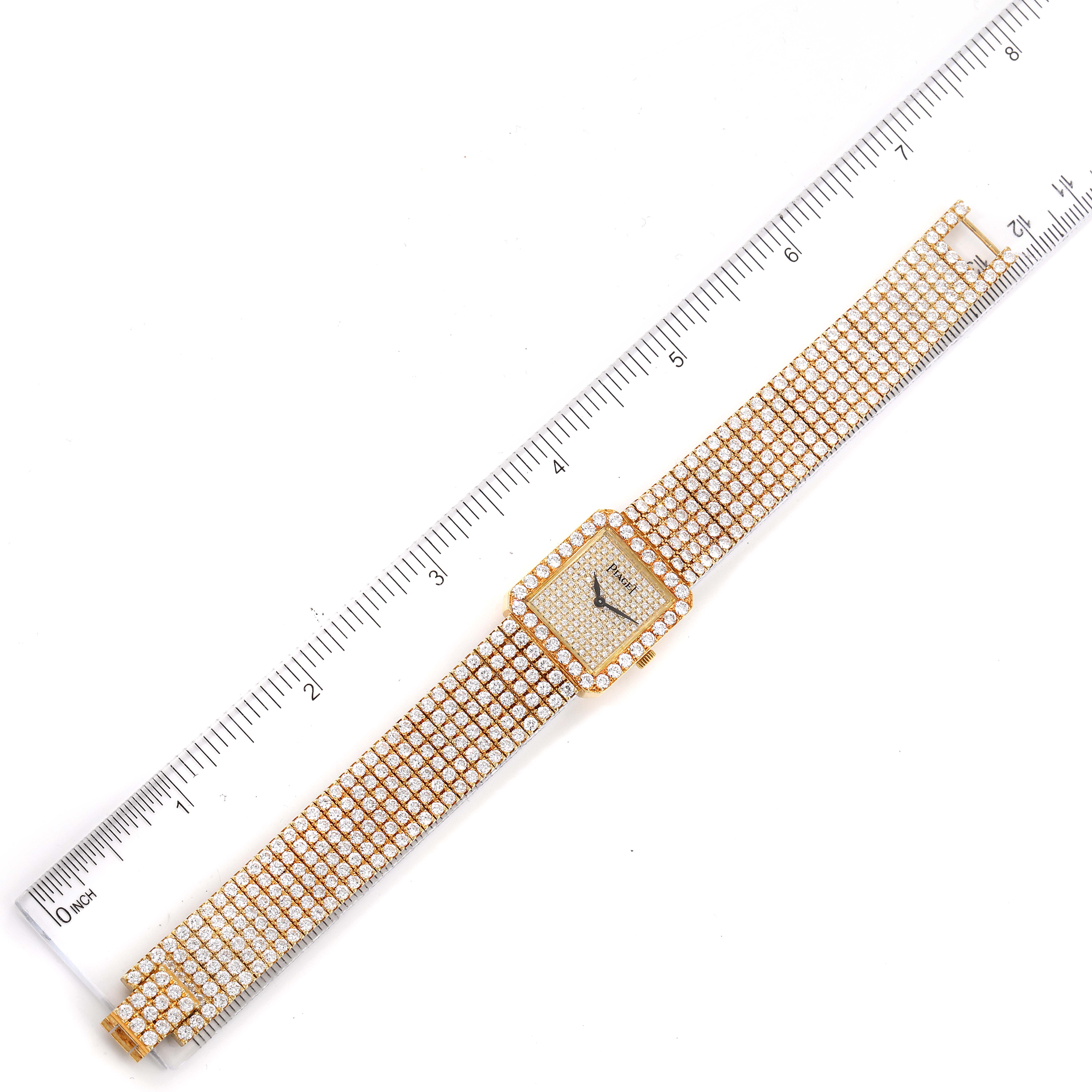 The image shows the Piaget 83541 C626 Women's Yellow Gold  83541 C626 Women's Yellow Gold  model 83541 ladies watch, taken from an overhead angle, displaying the entire bracelet and face with a ruler for scale.