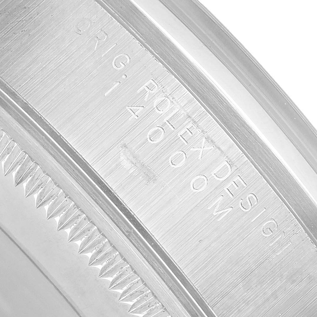 The image shows a close-up of the side engravings on the bezel of the Rolex Air-King 14000 Men's Stainless Steel Black Dial watch.