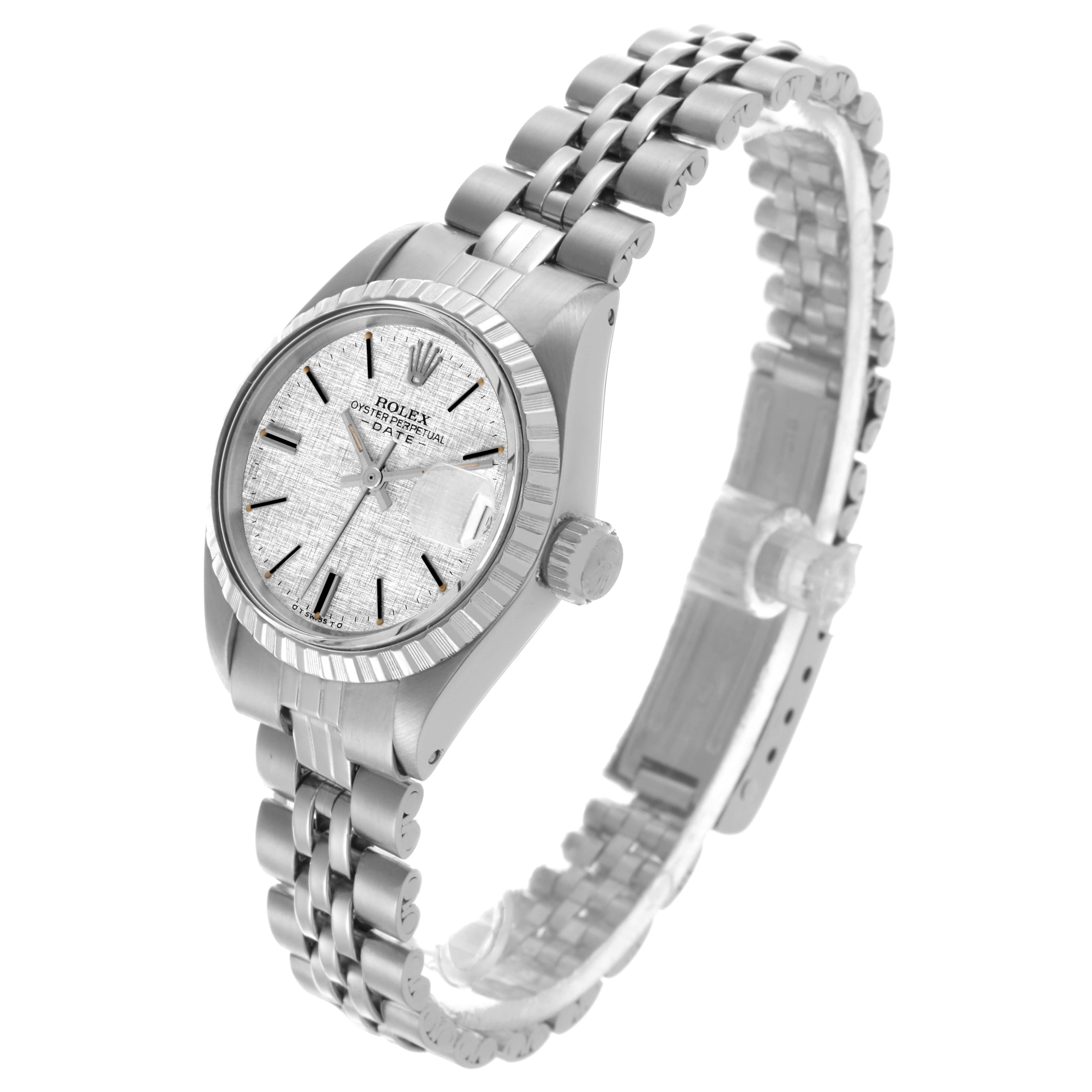 The Rolex Date 6924 Women
s Stainless Steel Silver Dial 6924 Women
s Stainless Steel Silver Dial watch is shown at a three-quarter angle, displaying the face, bezel, bracelet, and crown.