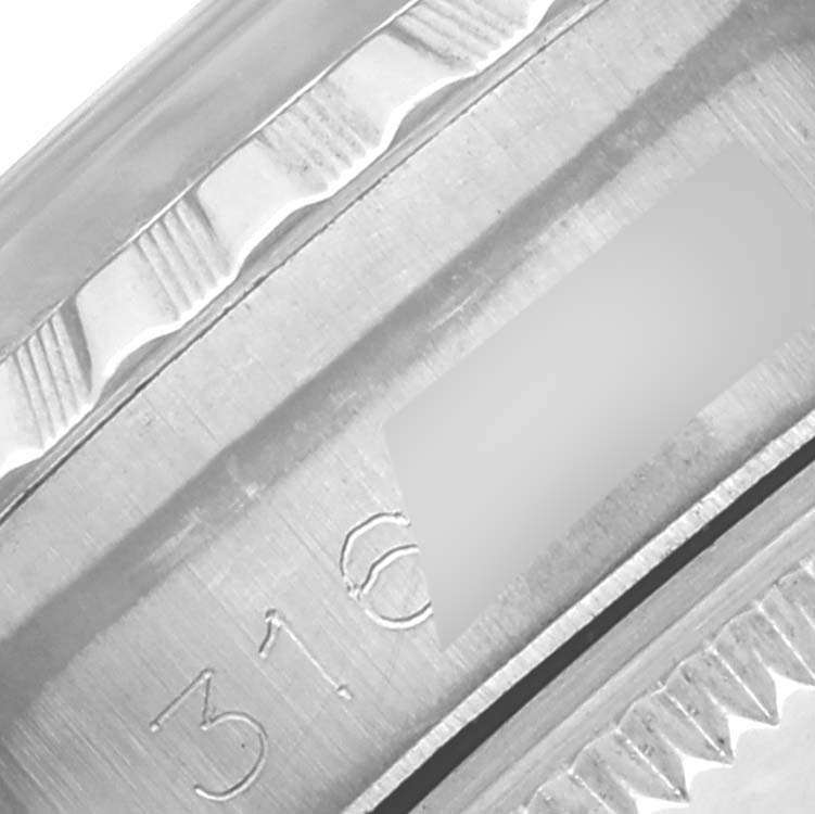 The image shows a close-up of the bezel and part of the case of the Rolex Date 6924 Women
s Stainless Steel Silver Dial 6924 Women
s Stainless Steel Silver Dial, highlighting the fluted design and engraved details.