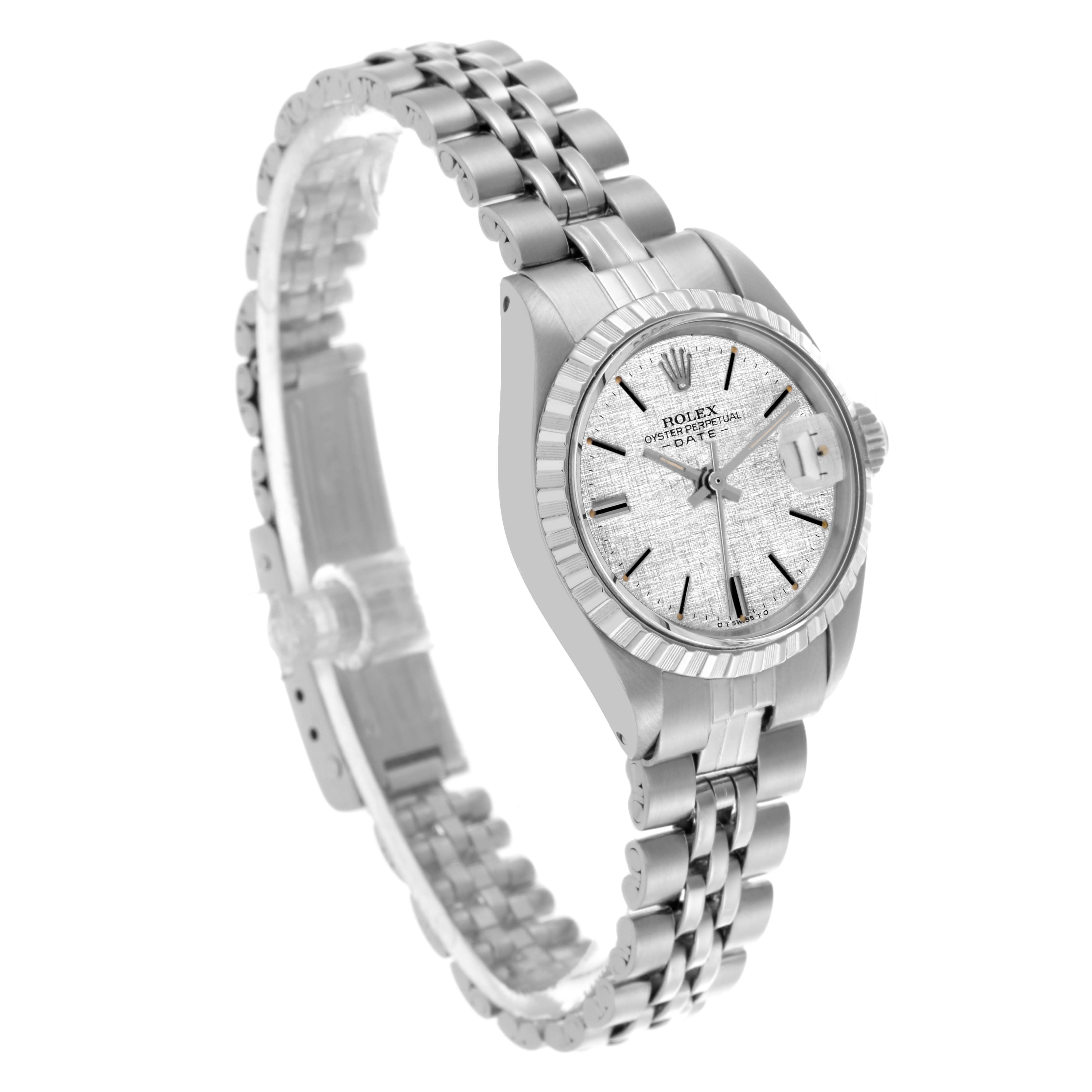 The Rolex Date 6924 Women
s Stainless Steel Silver Dial 6924 Women
s Stainless Steel Silver Dial watch is shown at a three-quarter angle, displaying the face, bezel, crown, and part of the bracelet.