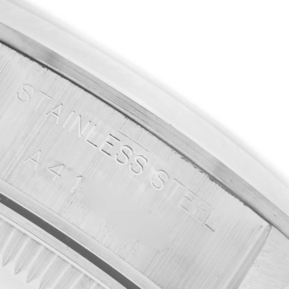 The image shows a close-up of the case back edge with engravings for the Rolex Date 69160 Women's Stainless Steel Silver Dial 69160 Women's Stainless Steel Silver Dial model.