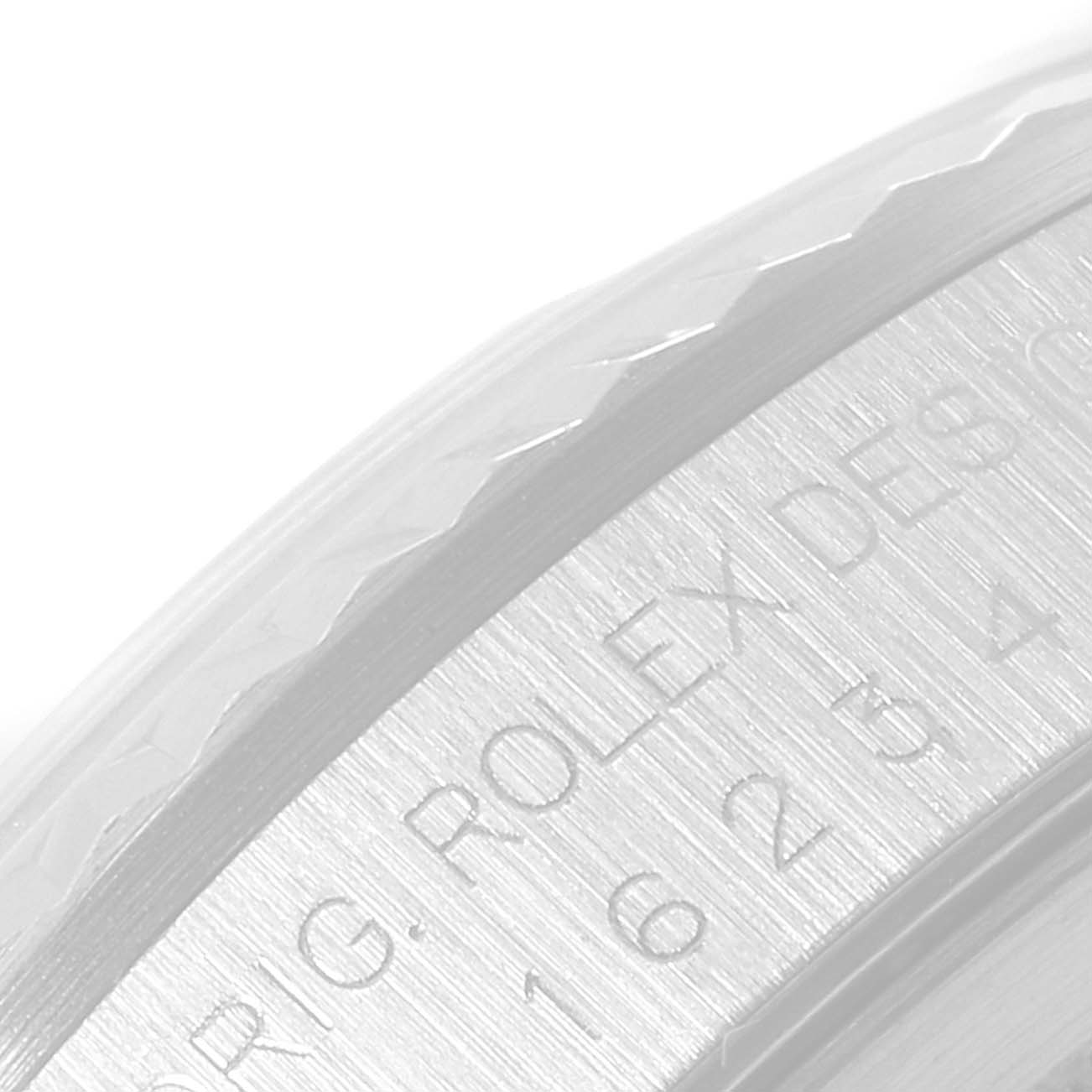 This image shows a close-up of the bezel and engraved text on the side of a Rolex Datejust 16234 Men's Stainless Steel Silver Dial 16234 Men's Stainless Steel Silver Dial watch.