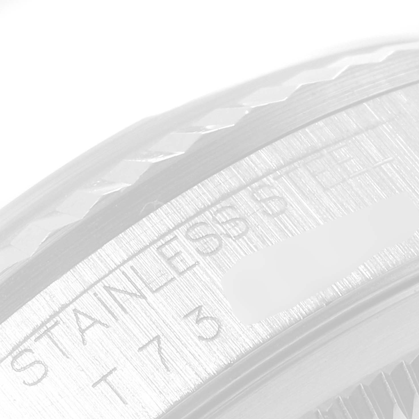 This image shows a close-up of the stainless steel bezel and edge of the casing of a Rolex Datejust 16234 Men's Stainless Steel Silver Dial 16234 Men's Stainless Steel Silver Dial watch.