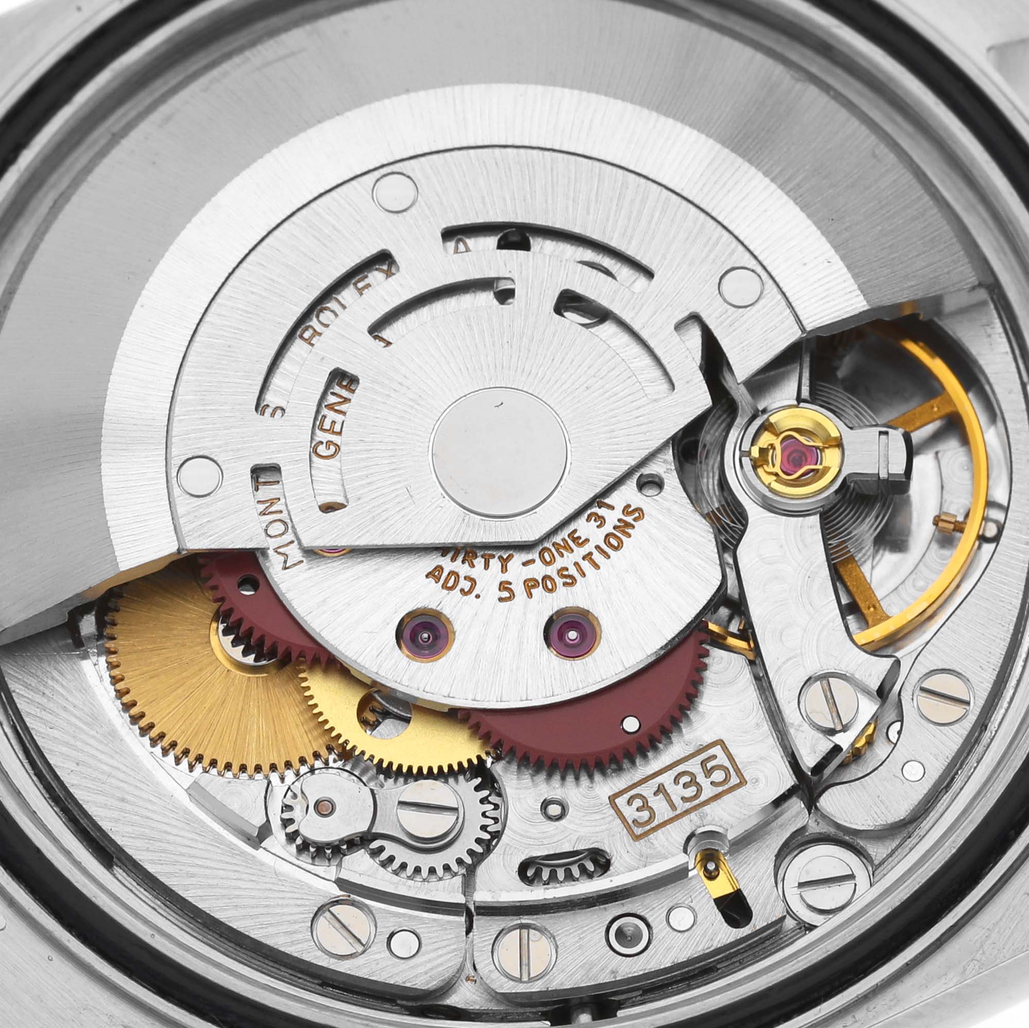 This image shows a close-up view of the Rolex Datejust 16233 Men's Steel and Gold (two tone) Silver Dial 16233 Men's Steel and Gold (two tone) Silver Dial watch movement and inner mechanical parts.