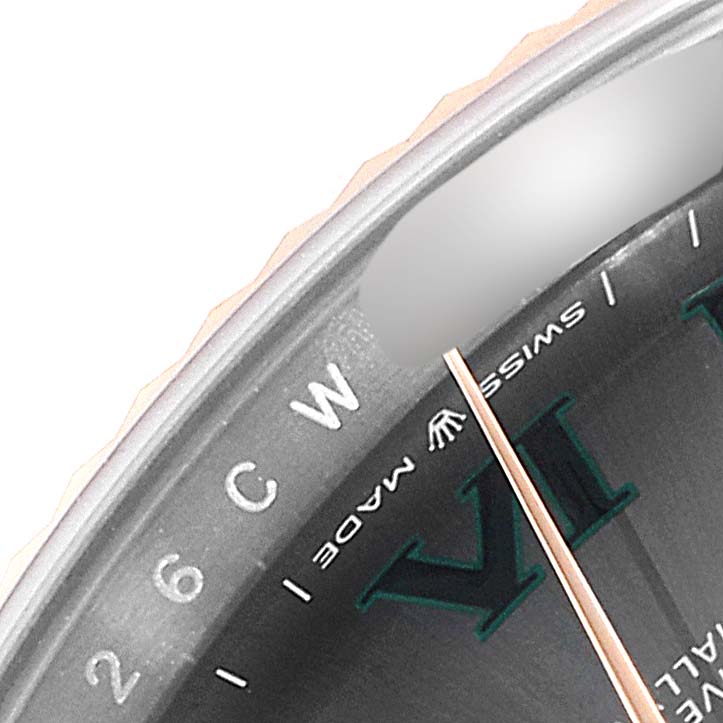 The image shows a close-up of the dial and part of the bezel of the Rolex Datejust 41 126331 Men's Steel and Gold (two tone) Grey Dial 126331 Men's Steel and Gold (two tone) Grey Dial, focusing on the hour markers and "SWISS MADE" text.