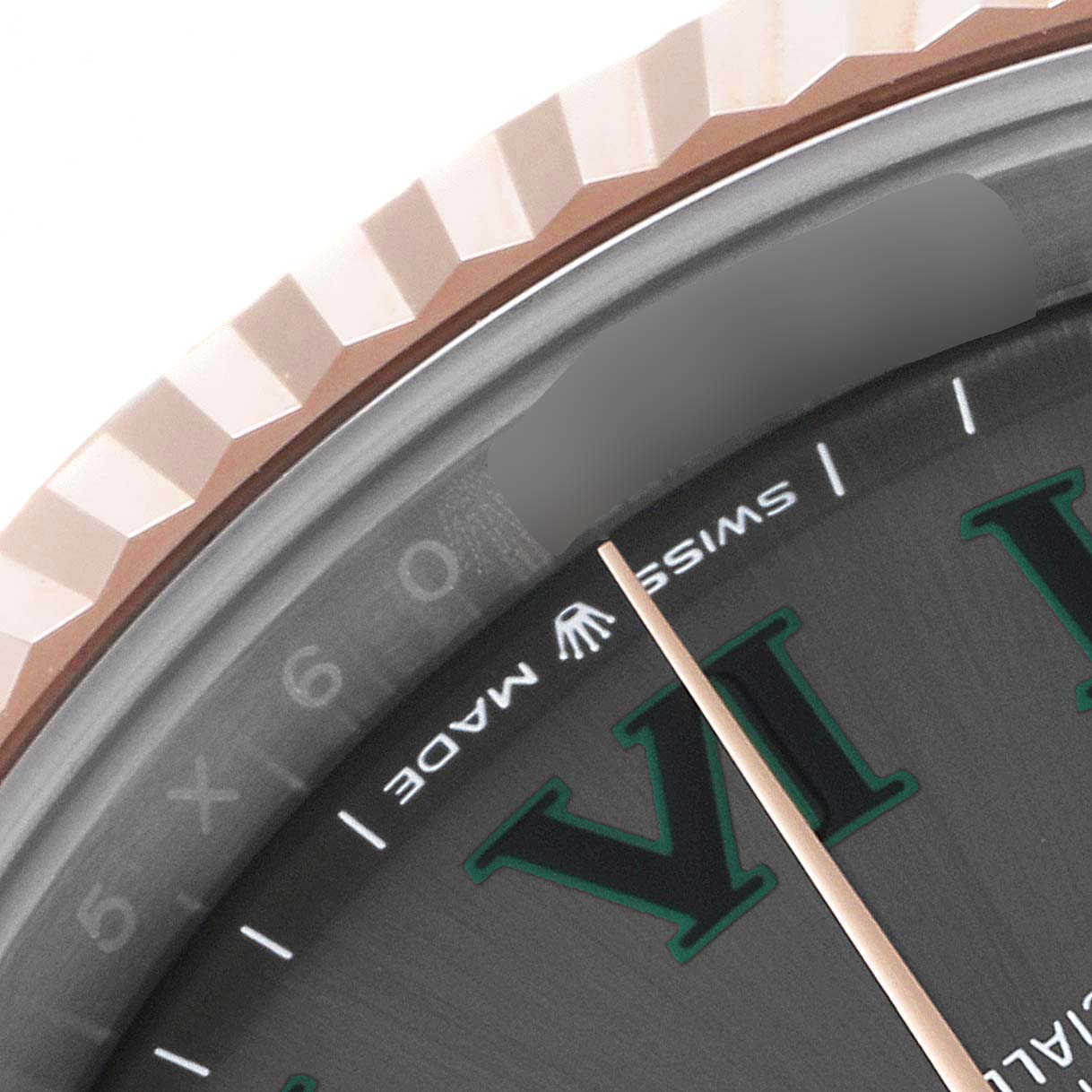 The image shows a close-up of the bezel and part of the dial of a Datejust 41 by Rolex.
