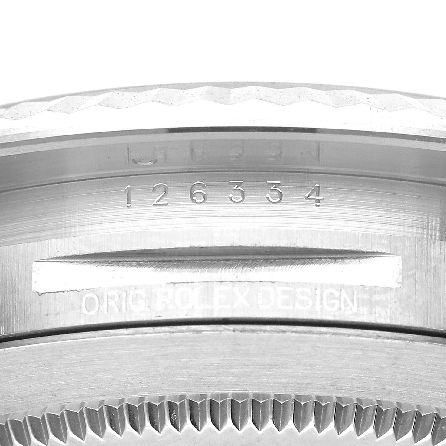 This close-up image of the Rolex Datejust 41 126334 Men
s Stainless Steel Blue Dial 126334 Men
s Stainless Steel Blue Dial shows the model number and edge of the watch case and bezel.