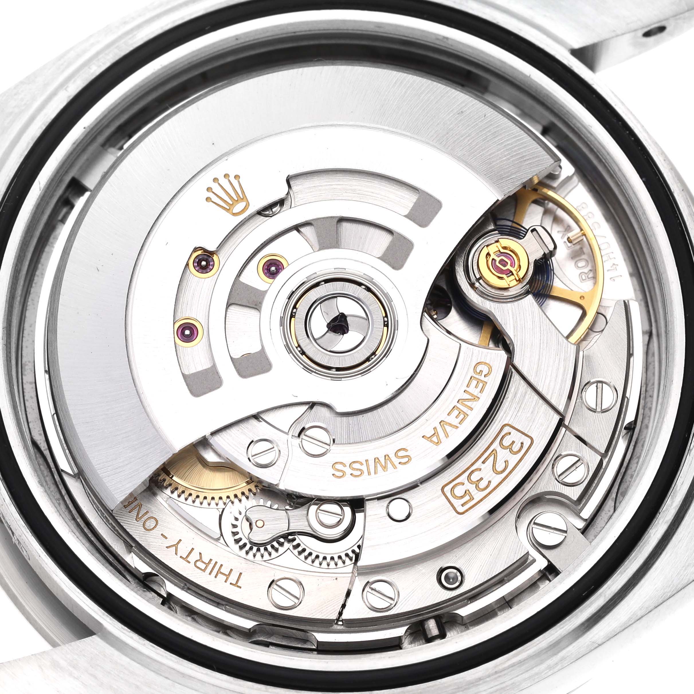 The image shows the internal mechanism of the Rolex Datejust 41 126334 Men
s Stainless Steel Blue Dial 126334 Men
s Stainless Steel Blue Dial watch, specifically the movement and rotor assembly.
