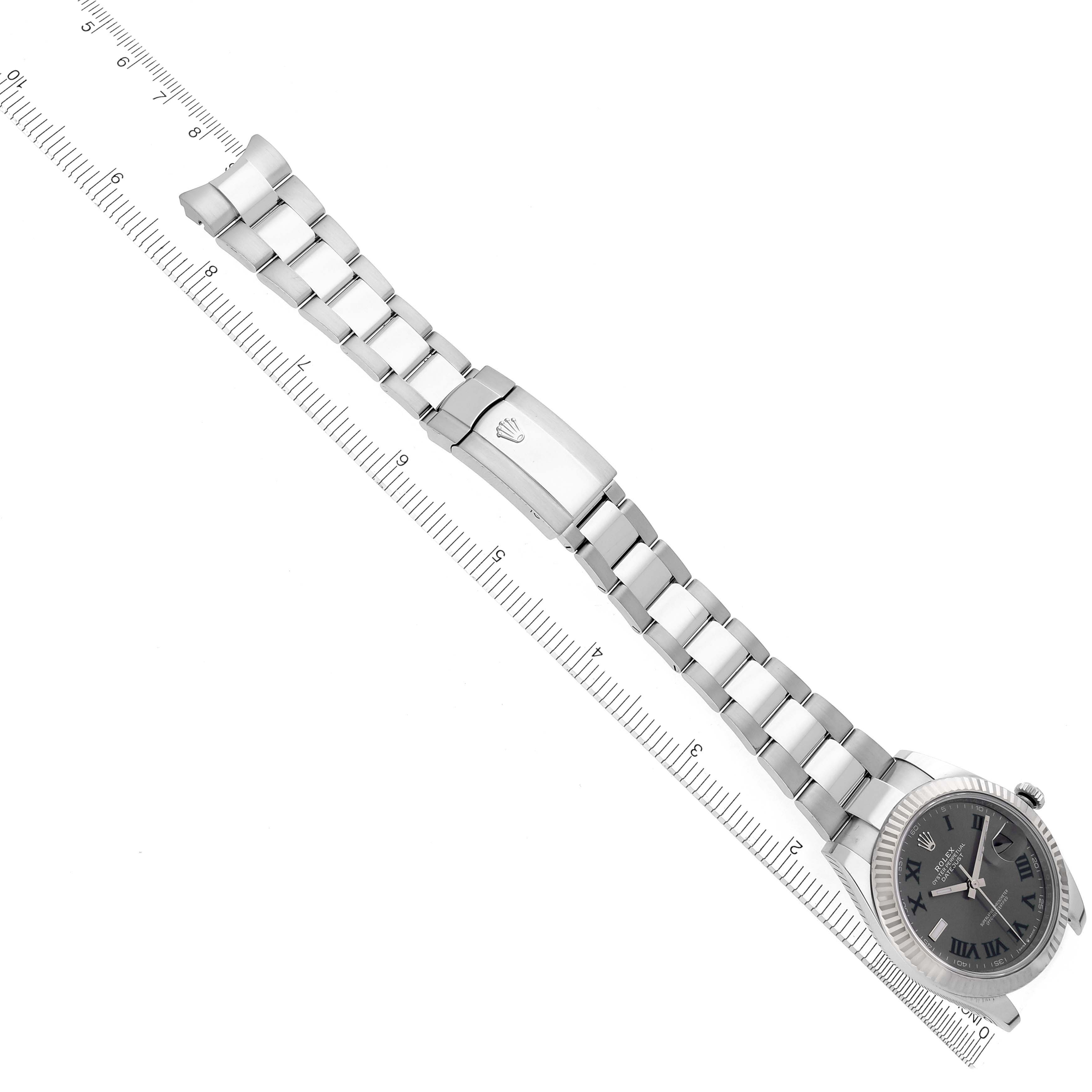 The Rolex Datejust 41 126334 Men's Stainless Steel Grey Dial 126334 Men's Stainless Steel Grey Dial watch is shown from a top view, displaying the bracelet, clasp, and face alongside a ruler for scale.