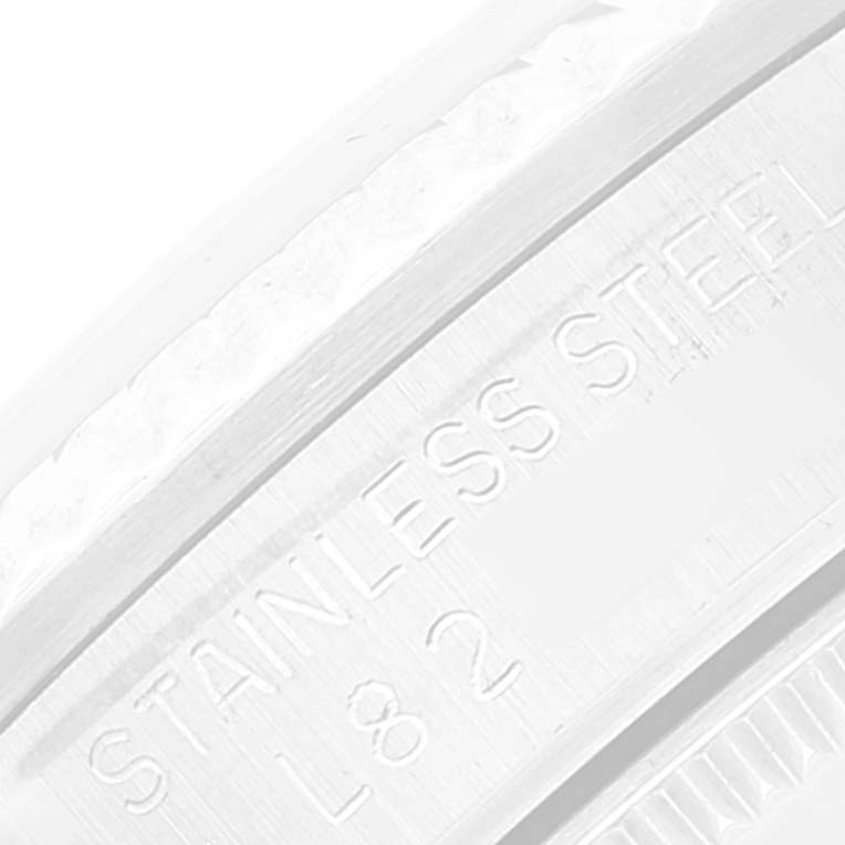 This close-up image shows the inner bezel of a Rolex Mid-Size 68274 Women
s Stainless Steel Silver Dial 68274 Women
s Stainless Steel Silver Dial model, engraved with "STAINLESS STEEL L82."