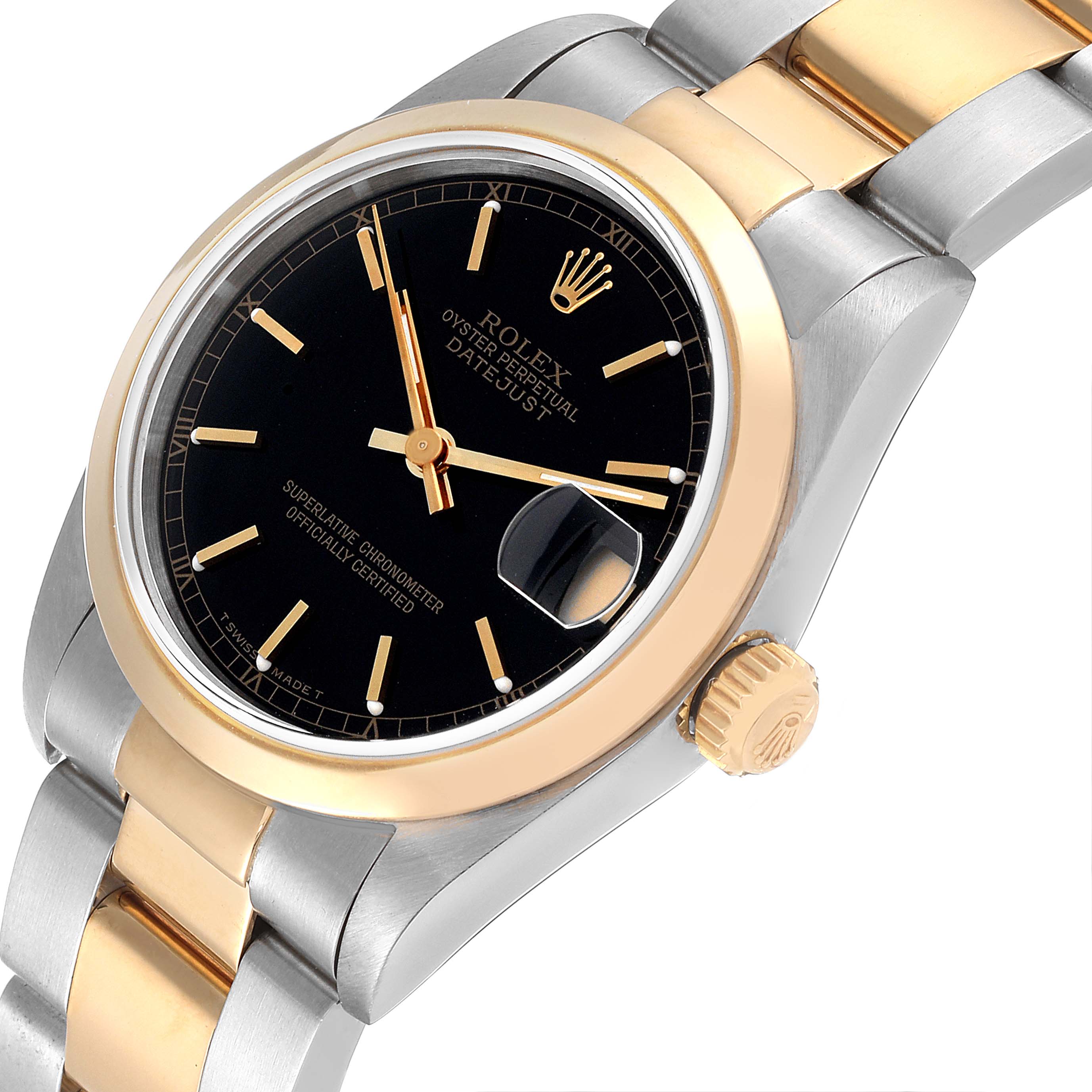 This Rolex Mid-Size 68243 Women
s Steel and Gold (two tone) Black Dial 68243 Women
s Steel and Gold (two tone) Black Dial Datejust watch is shown at an angle highlighting the dial, bezel, crown, and partially the bracelet.