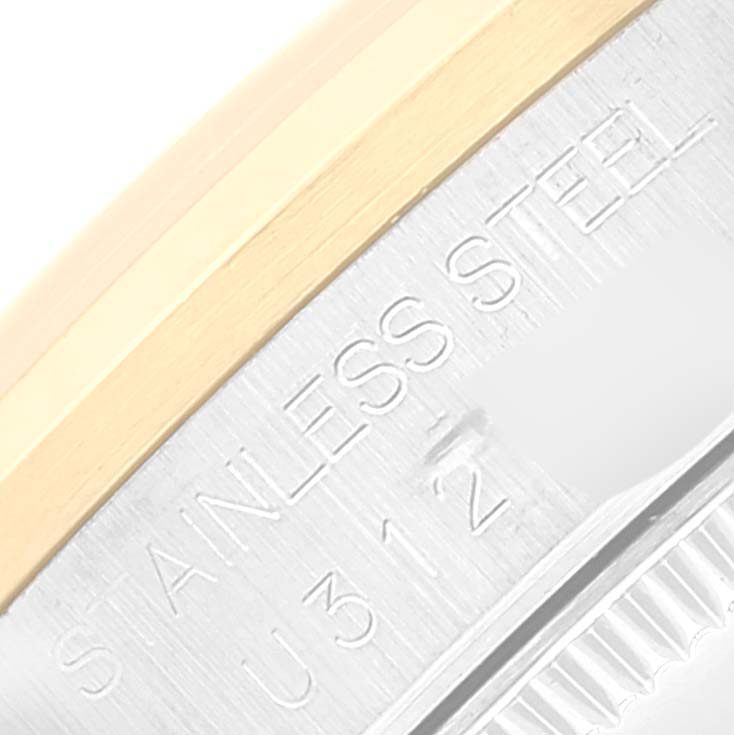 Close-up of the side of a Mid-Size Rolex watch, showing the stainless steel engraving and part of the bezel.
