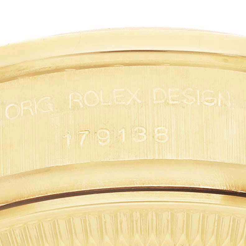 The image shows a close-up of the side of a Rolex President 179138 Women's Yellow Gold Champagne Dial, focusing on the engraved model number.