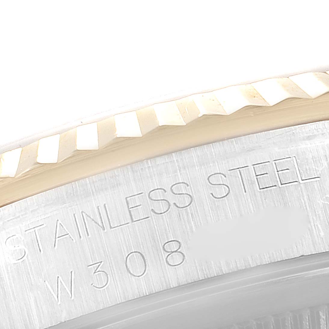 This close-up image shows the fluted bezel and part of the case with engravings on a Rolex Datejust 16233 Men's Steel and Gold (two tone) White Dial 16233 Men's Steel and Gold (two tone) White Dial watch.