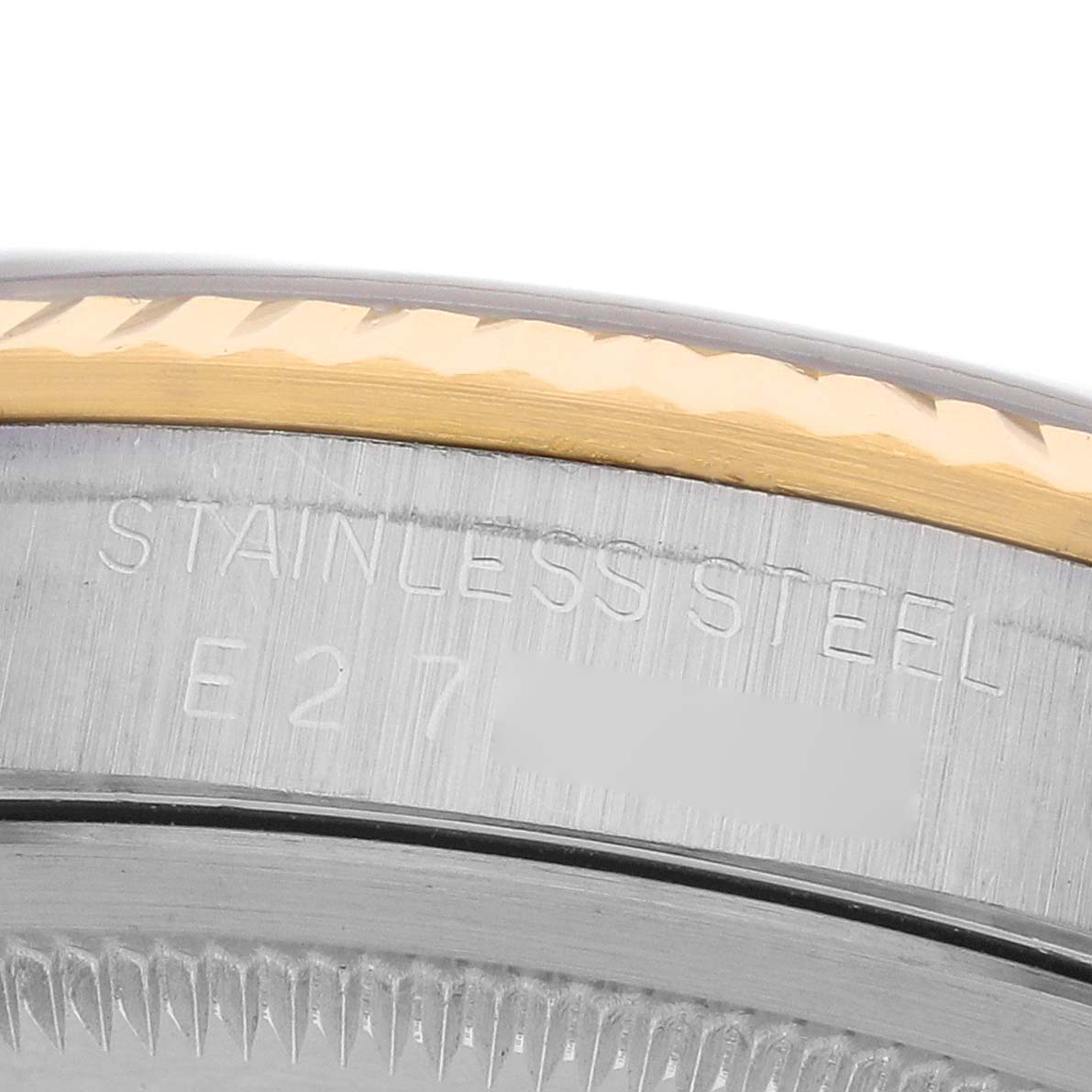 The image shows a close-up of the Rolex Datejust 16233 Men's Steel and Gold (two tone) Blue Dial case edge, highlighting the stainless steel engraving and part of the bezel.