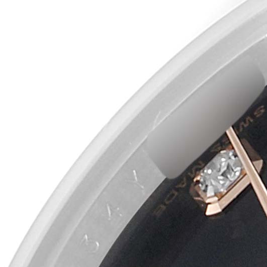 This close-up image shows a portion of the dial and diamond markers of the Rolex Datejust 179171 Women's Steel and Gold (two tone) Black Dial 179171 Women's Steel and Gold (two tone) Black Dial watch.