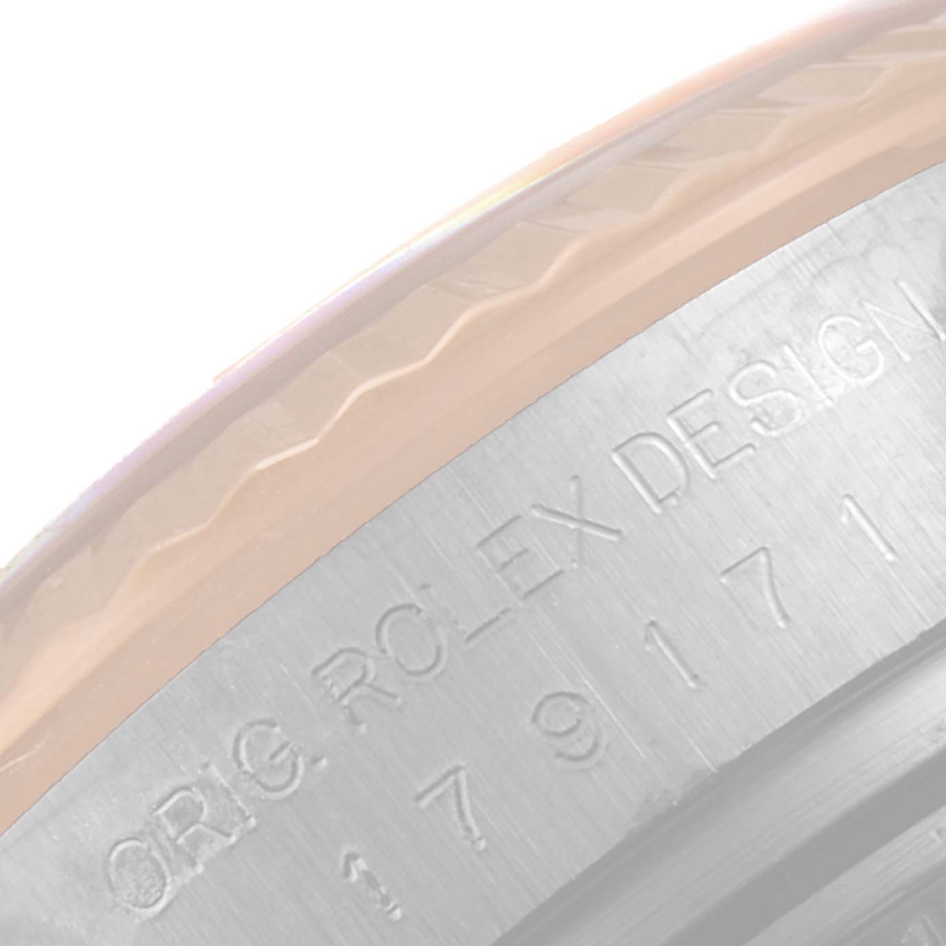 This image shows a close-up of the case side and part of the bezel of a Rolex Datejust 179171 Women's Steel and Gold (two tone) Black Dial 179171 Women's Steel and Gold (two tone) Black Dial watch, highlighting its engraved markings.