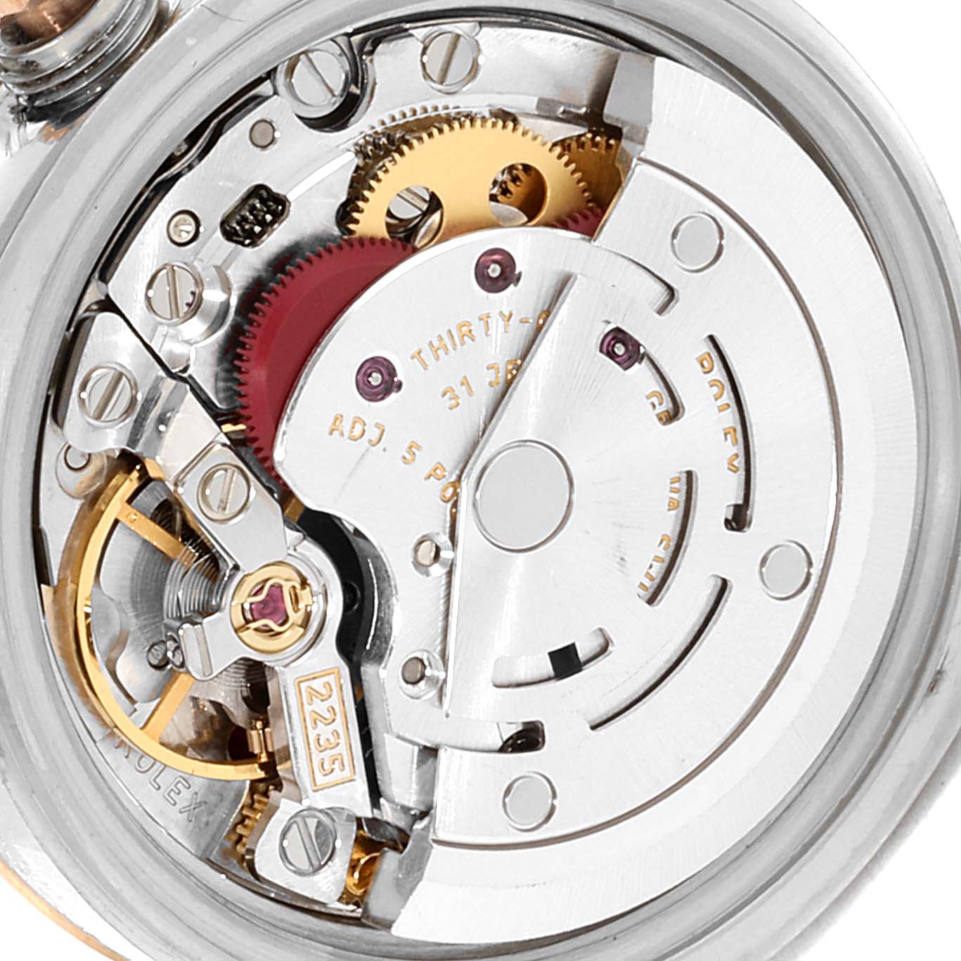 This image shows a close-up of the internal mechanical movement of a Rolex Datejust 179171 Women's Steel and Gold (two tone) Black Dial 179171 Women's Steel and Gold (two tone) Black Dial watch.