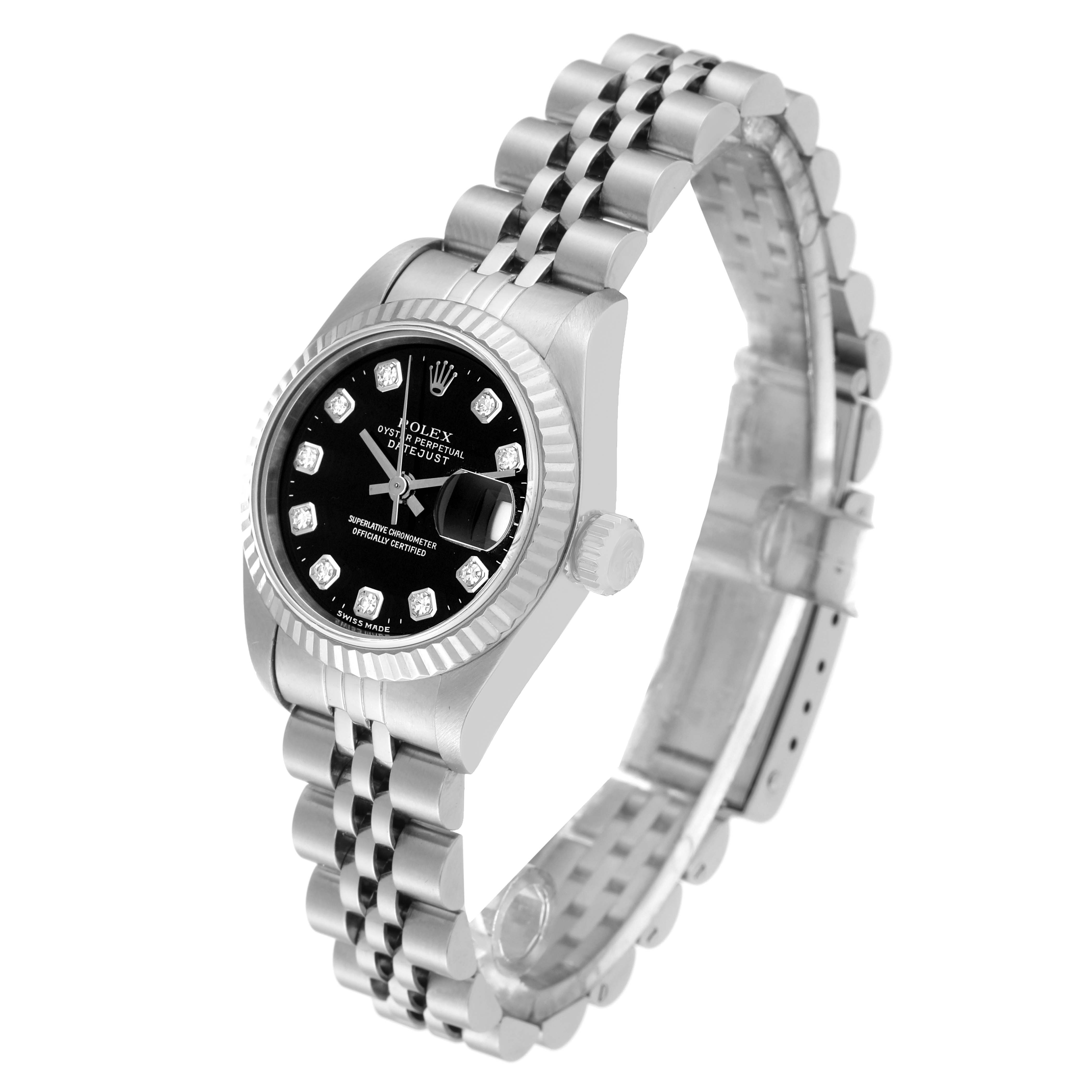 The Rolex Datejust 69174 Women's Stainless Steel Black Dial 69174 Women's Stainless Steel Black Dial watch is shown at an angle that highlights its face, bezel, crown, and jubilee bracelet.