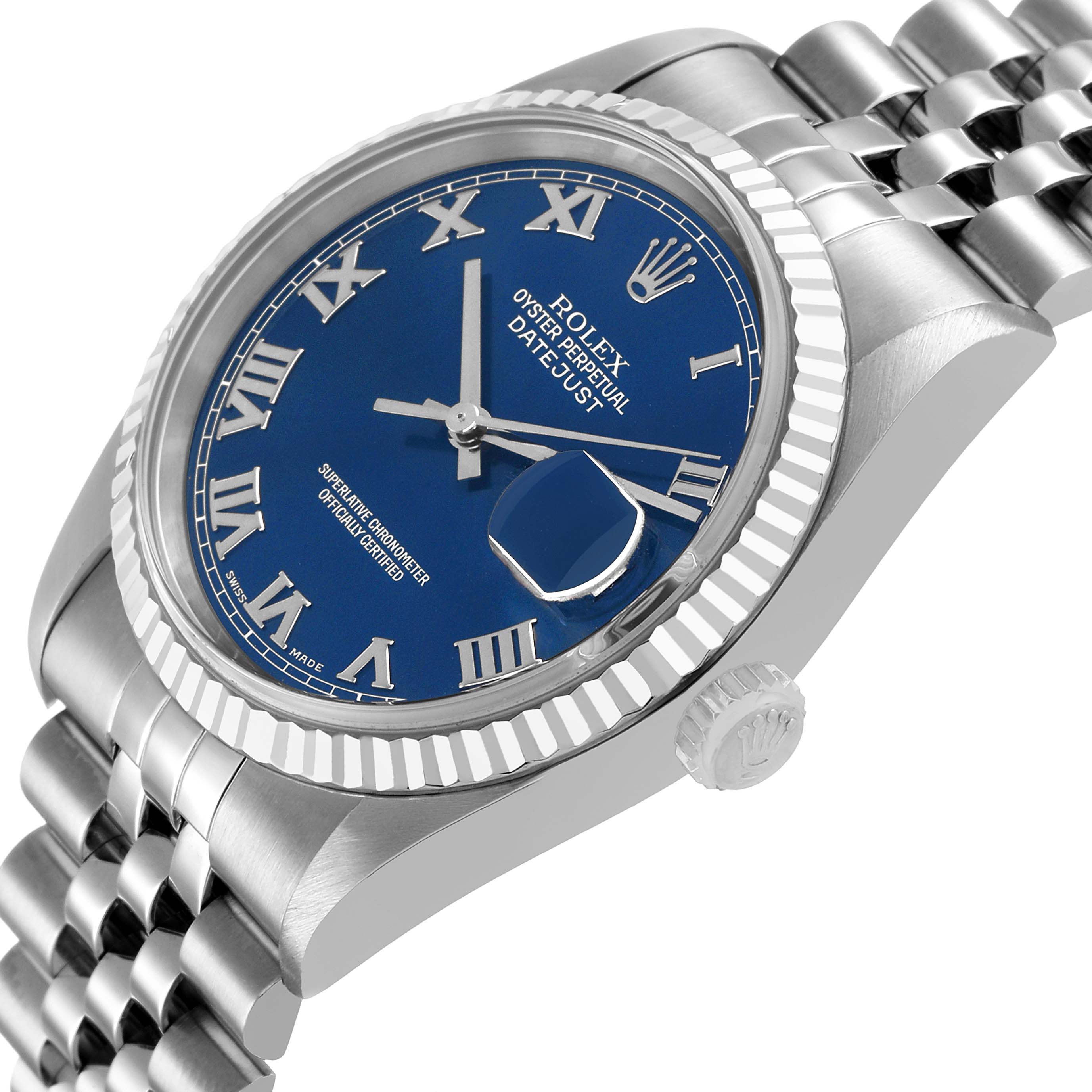 The Rolex Datejust 16234 Men's Stainless Steel Blue Dial watch is shown at an angle displaying the blue dial, fluted bezel, crown, and part of the jubilee bracelet.