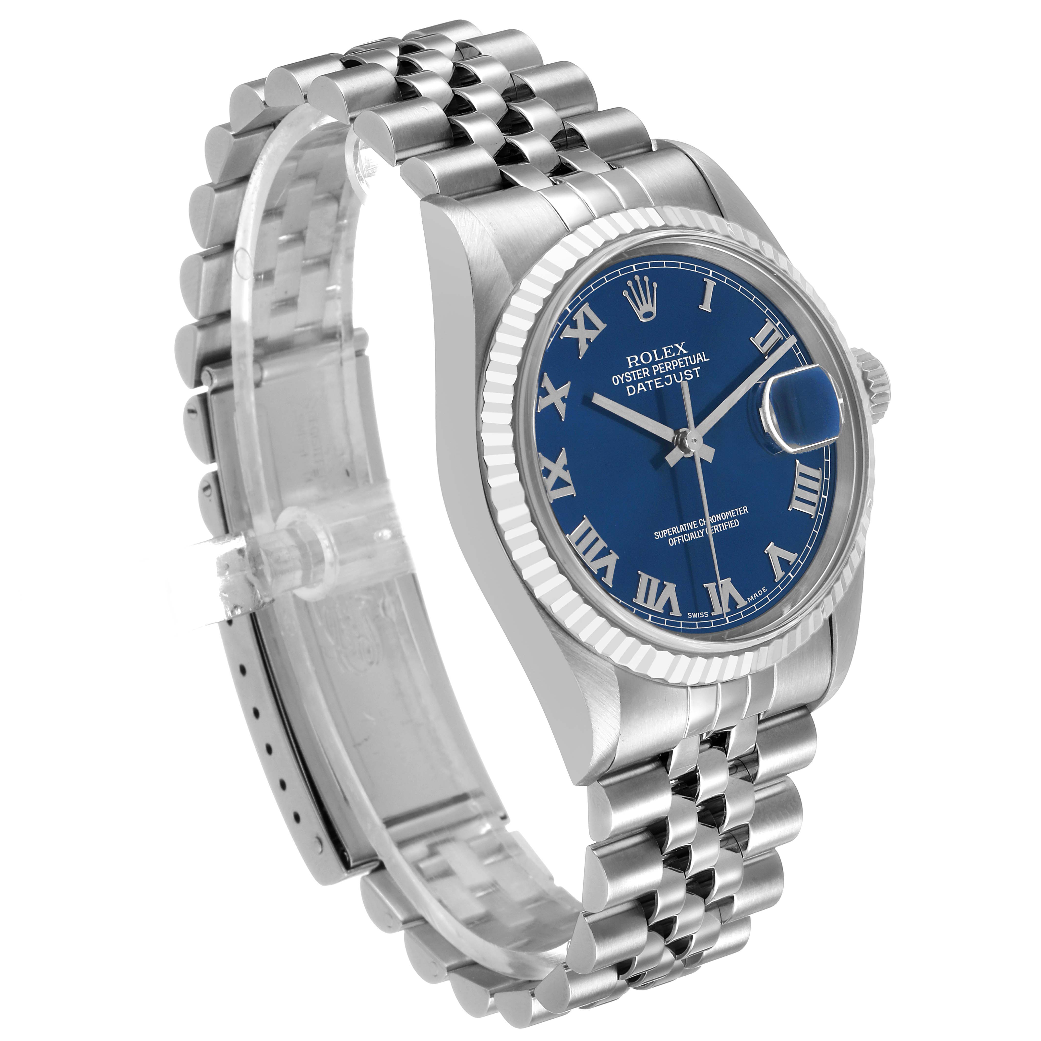 The Rolex Datejust 16234 Men's Stainless Steel Blue Dial watch is shown at a slight angle displaying the blue dial, Roman numerals, fluted bezel, and Jubilee bracelet.
