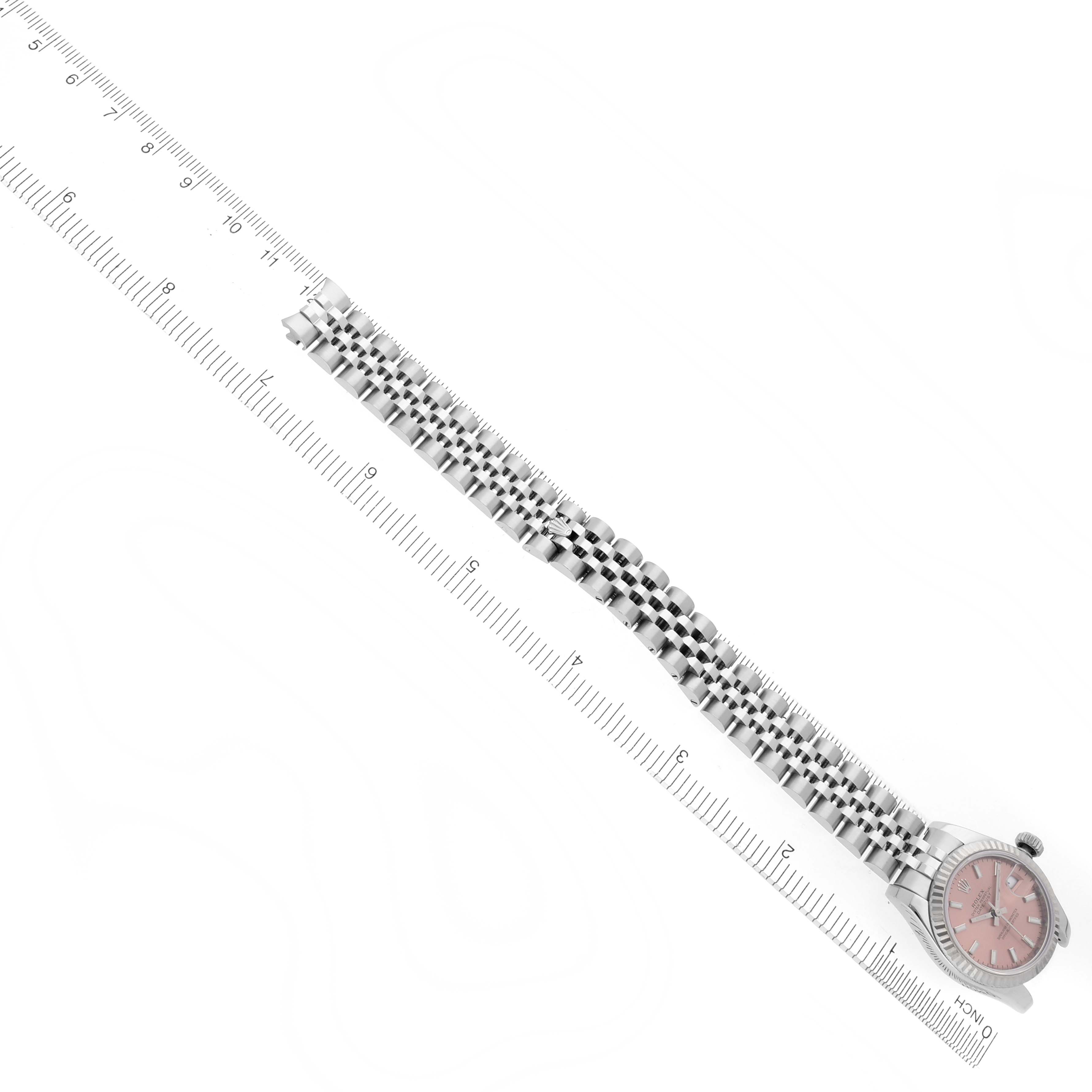 The image shows a side angle of the Rolex Datejust 179174 Women's Steel and Gold (two tone) Pink Dial 179174 Women's Steel and Gold (two tone) Pink Dial watch, highlighting its bracelet and partial view of the watch face.