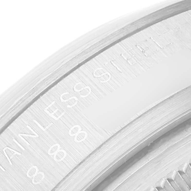 This close-up image shows the engraved text "STAINLESS STEEL" on the caseback of a Rolex Datejust 16014 Men's Stainless Steel Silver Dial 16014 Men's Stainless Steel Silver Dial watch.