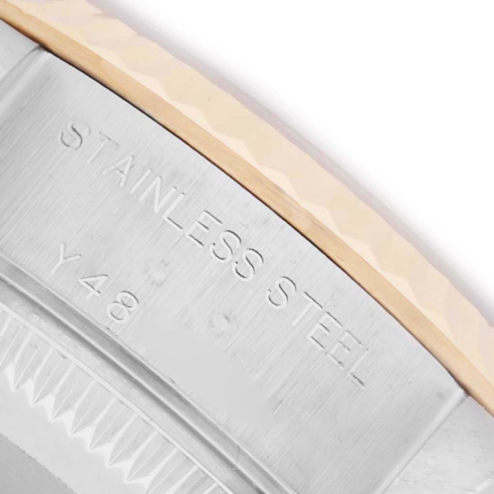 The image shows a close-up of the side engraving and bezel of a Rolex Datejust 79173 Women's Steel and Gold (two tone) Black Dial 79173 Women's Steel and Gold (two tone) Black Dial watch, highlighting "Stainless Steel."