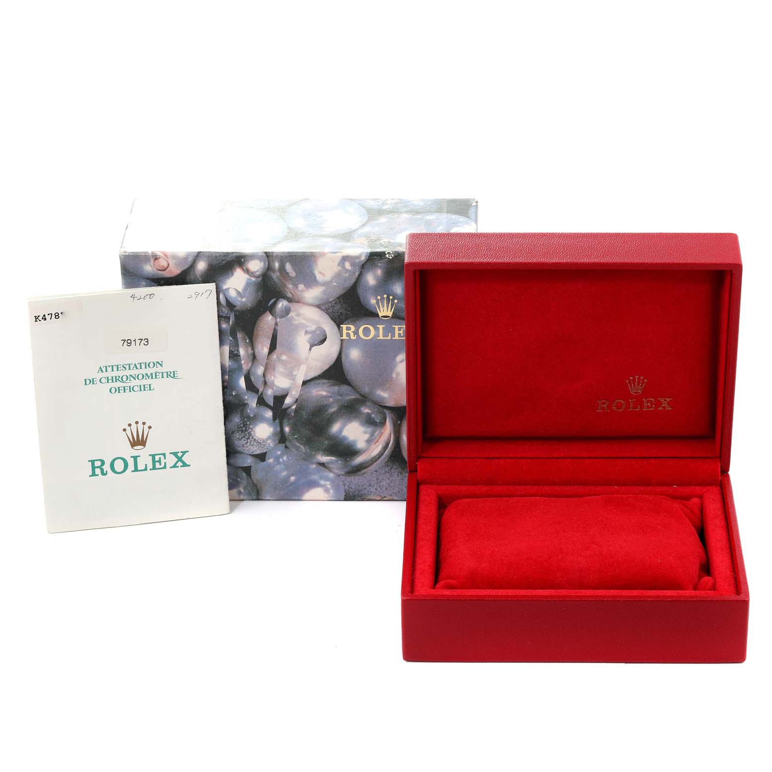 The image shows accessories for a Rolex Datejust 79173 Women's Steel and Gold (two tone) Champagne Dial 79173 Women's Steel and Gold (two tone) Champagne Dial watch, including a box, an outer packaging, and a certificate.