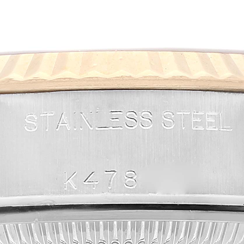 The image shows a close-up of the stainless steel case and fluted bezel of a Rolex Datejust 79173 Women's Steel and Gold (two tone) Champagne Dial 79173 Women's Steel and Gold (two tone) Champagne Dial watch.