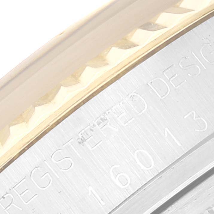 The image shows a close-up of the bezel and part of the case of a Rolex Vintage Collection 16013 Men's Steel and Gold (two tone) White Dial 16013 Men's Steel and Gold (two tone) White Dial model.