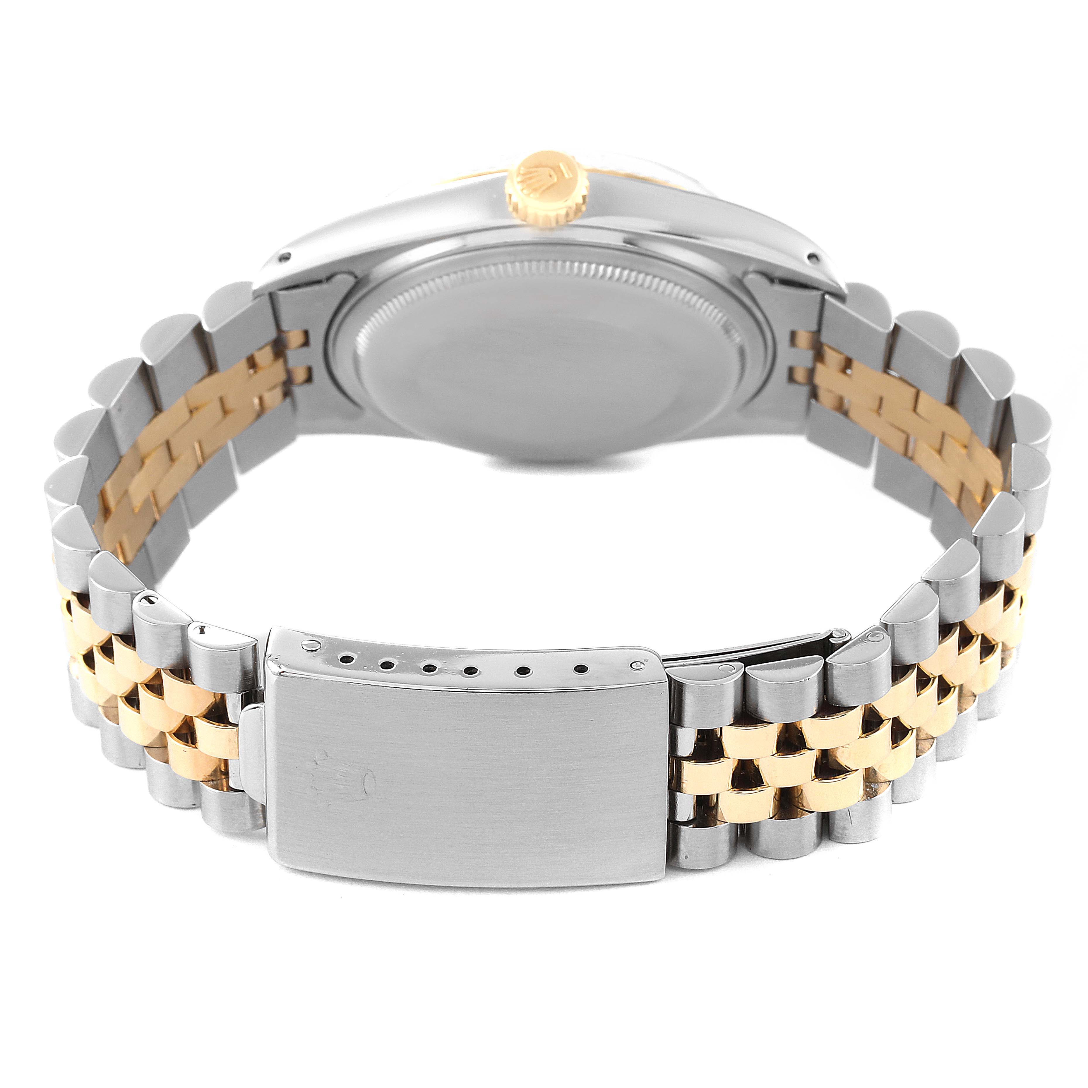 The image shows the backside of the Rolex Vintage Collection 16013 Men's Steel and Gold (two tone) White Dial 16013 Men's Steel and Gold (two tone) White Dial model, focusing on the clasp, bracelet, and case back.