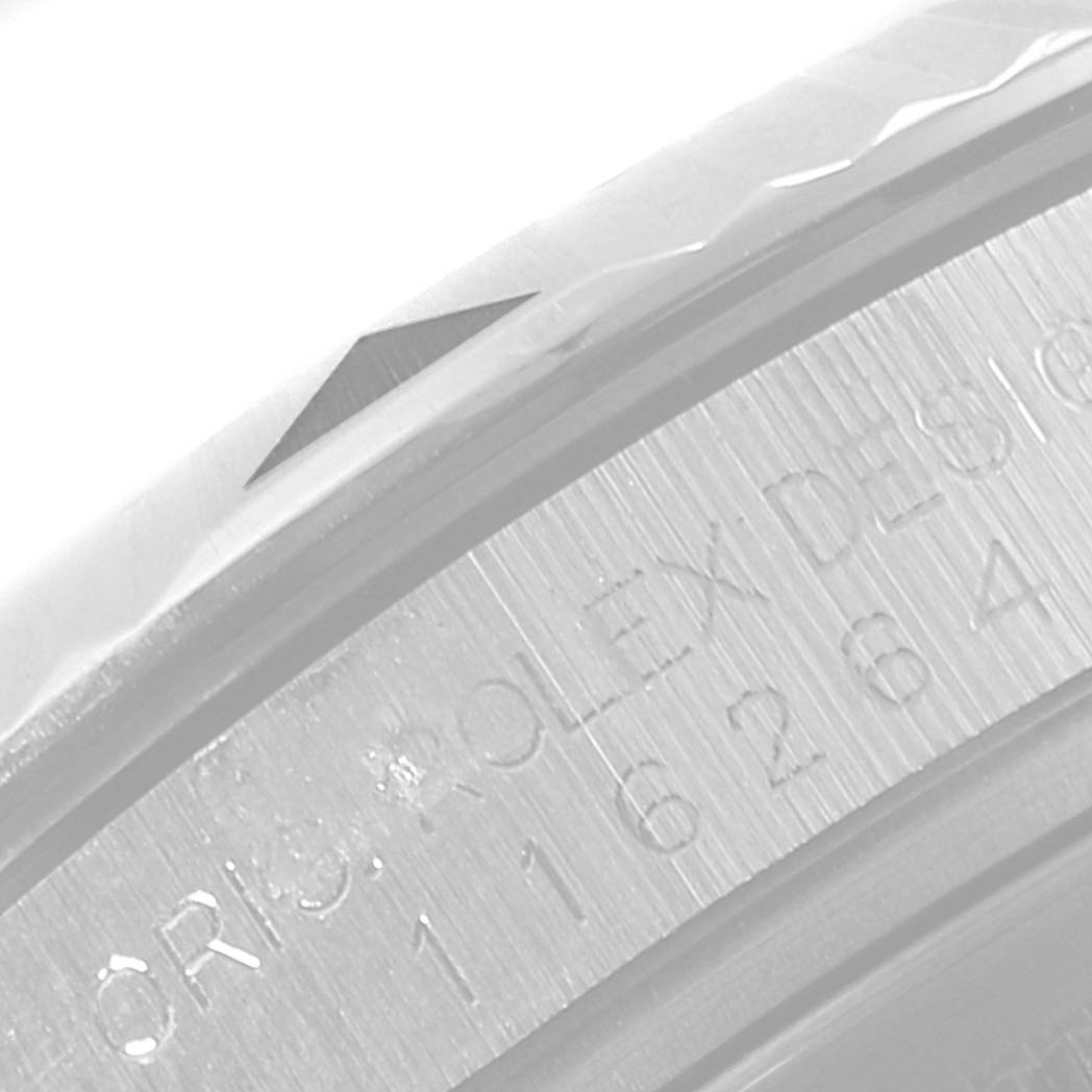 The image shows a close-up of the case edge and bezel of the Rolex Turn-o-Graph 116264 Men
s Stainless Steel Black Dial 116264 Men
s Stainless Steel Black Dial model with engravings visible.