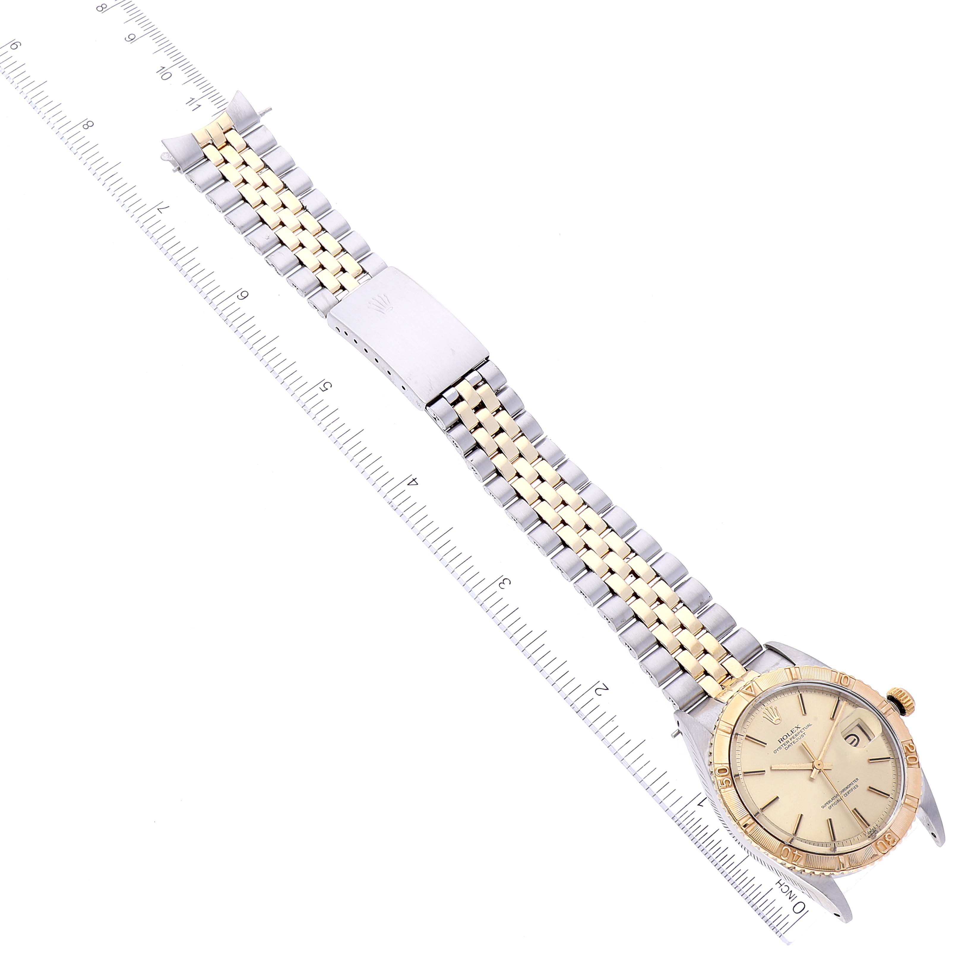 The image shows a top-down view of the Rolex Turn-o-Graph 1625 Men's Steel and Gold (two tone) Silver Dial 1625 Men's Steel and Gold (two tone) Silver Dial watch displaying its face, bezel, strap, and clasp.