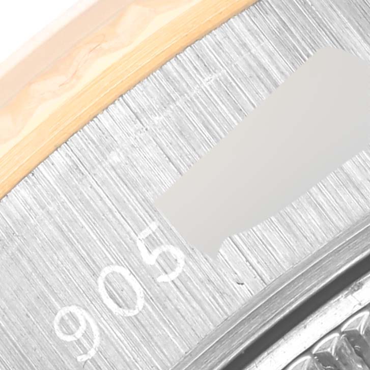 The image shows a close-up angle of the edge and bezel of a Rolex Datejust 69173 Women's Steel and Gold (two tone) White Dial 69173 Women's Steel and Gold (two tone) White Dial watch.
