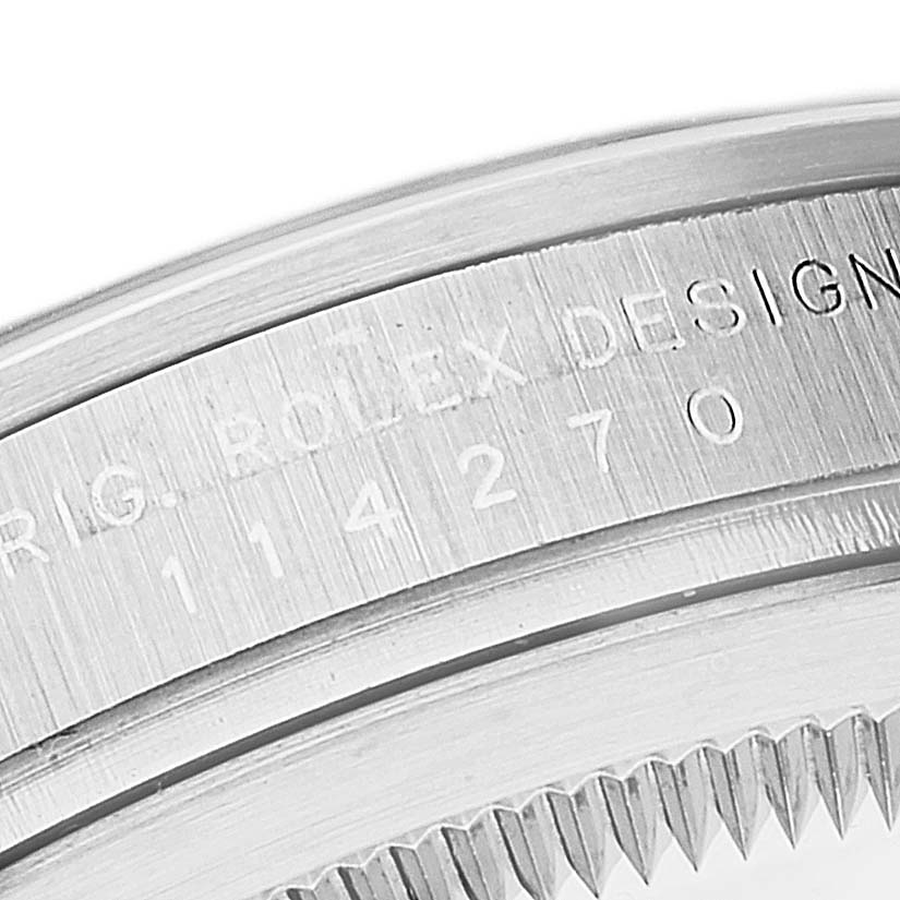 The image shows a close-up of the bezel and model number engraving on a Rolex Explorer 114270 Men
s Stainless Steel Black Dial 114270 Men
s Stainless Steel Black Dial watch.