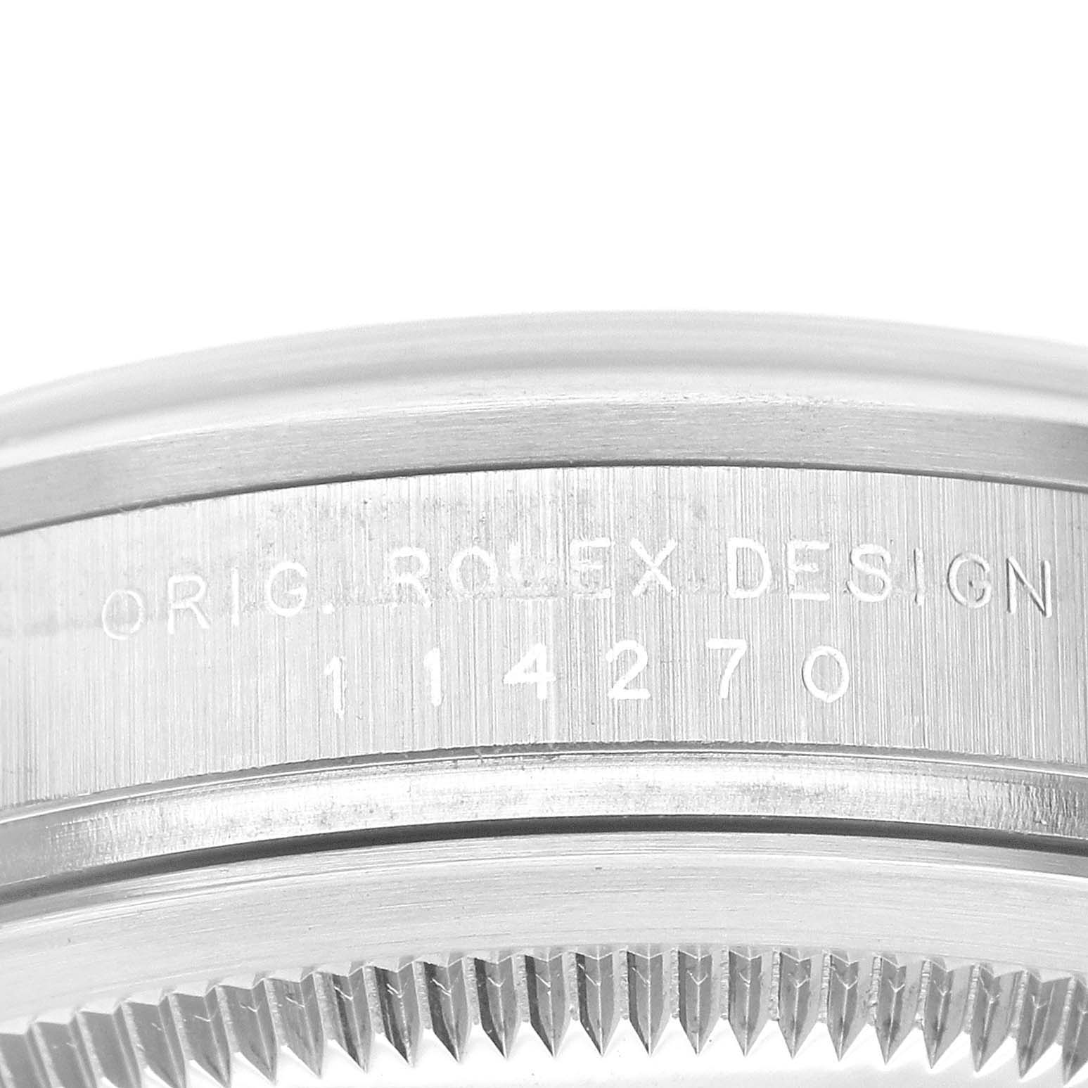 The image shows a close-up of the caseback
s engraving on a Rolex Explorer 114270 Men
s Stainless Steel Black Dial 114270 Men
s Stainless Steel Black Dial watch, displaying the model number 114270.