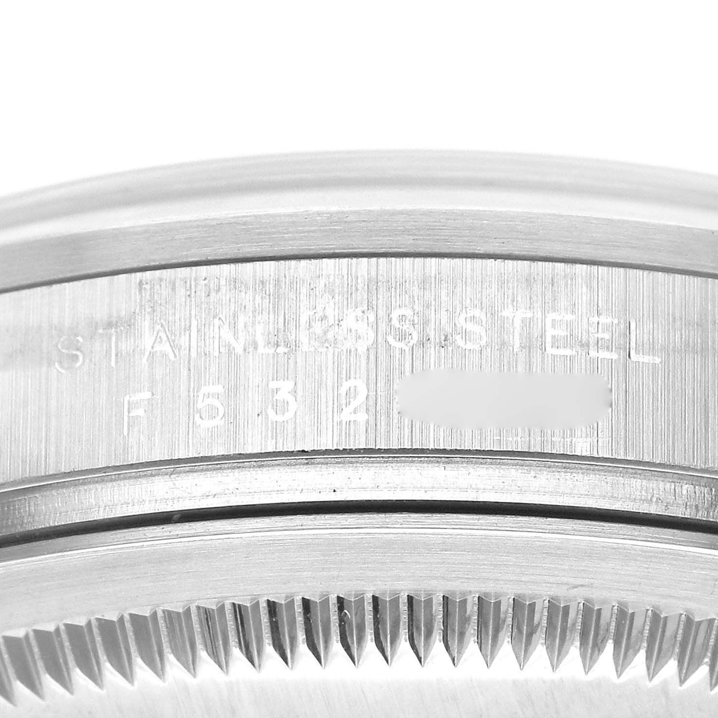 The image shows a close-up of the stainless steel casing and serial number of a Rolex Explorer 114270 Men
s Stainless Steel Black Dial 114270 Men
s Stainless Steel Black Dial watch.
