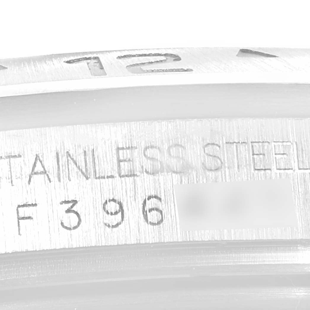 The image shows a close-up of the stainless steel case with serial engravings on a Rolex Explorer 16570 Men
s Stainless Steel White Dial 16570 Men
s Stainless Steel White Dial watch.