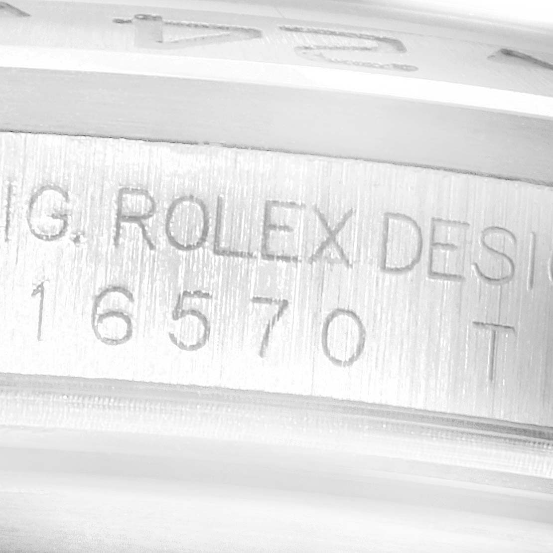 This close-up image shows the engraved model number and brand name inside the case of a Rolex Explorer 16570 Men
s Stainless Steel White Dial 16570 Men
s Stainless Steel White Dial watch.