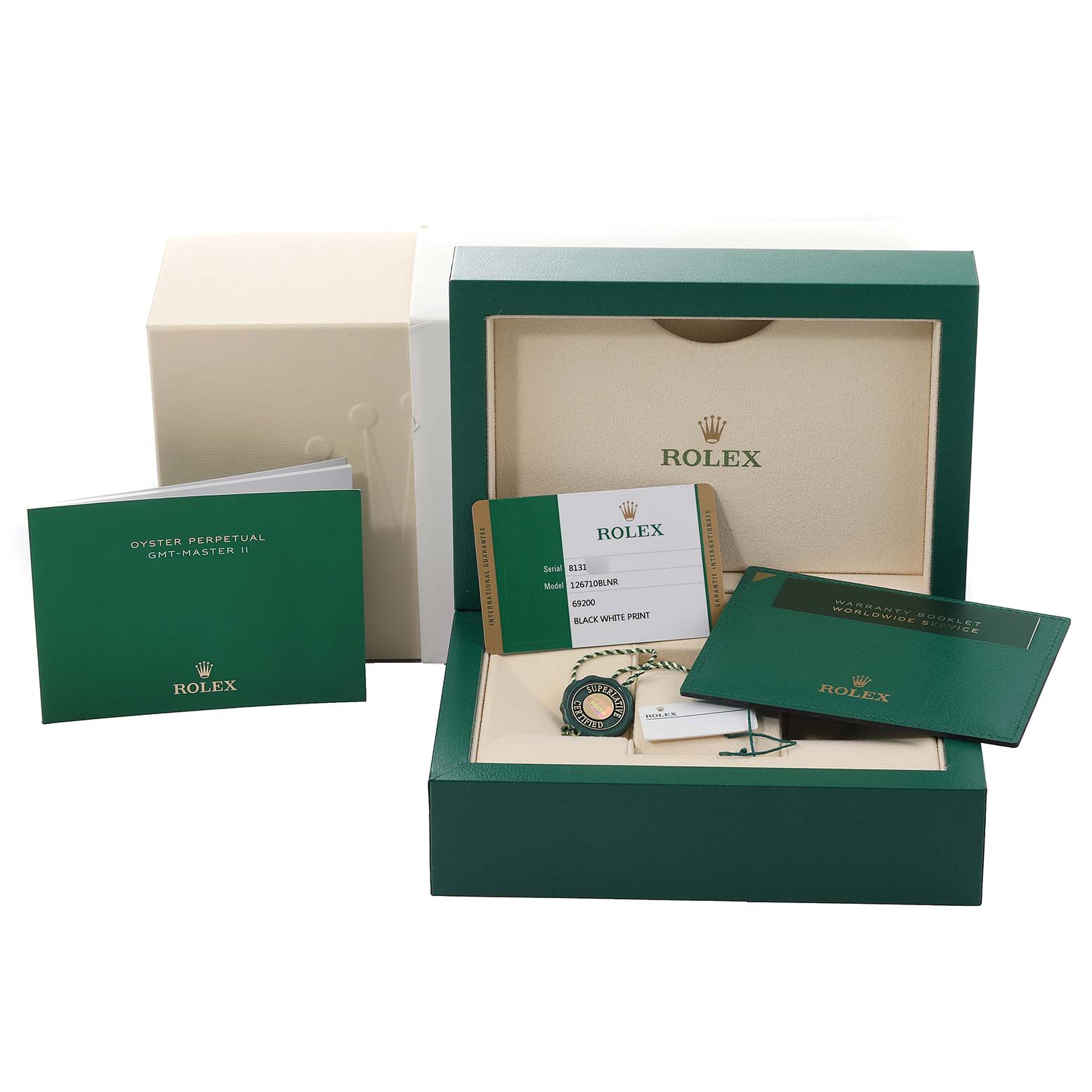 The photo shows the packaging, warranty cards, booklet, and tags for a Rolex GMT-Master 126710 Men
s Stainless Steel Black Dial 126710 Men
s Stainless Steel Black Dial II watch.